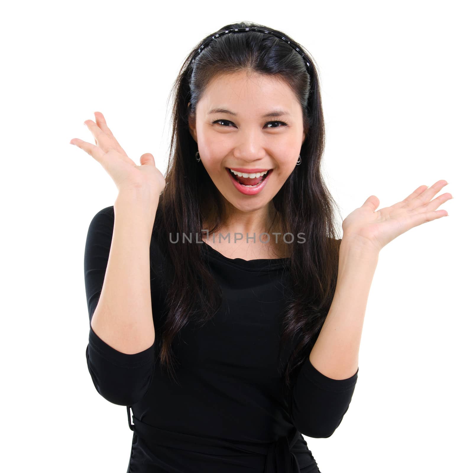 Businesswoman smiling with open mouth and open palms isolated on white background. Beautiful mixed race Caucasian Southeast Asian woman model.