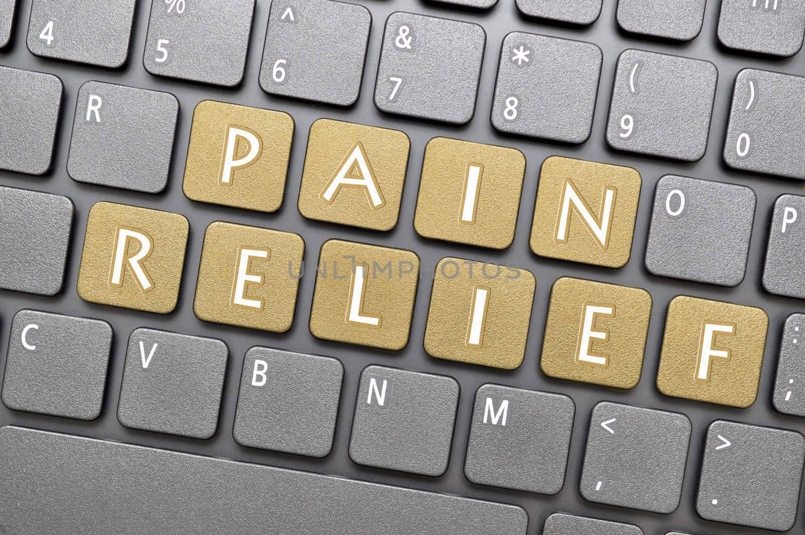 Golden pain relief key on keyboard