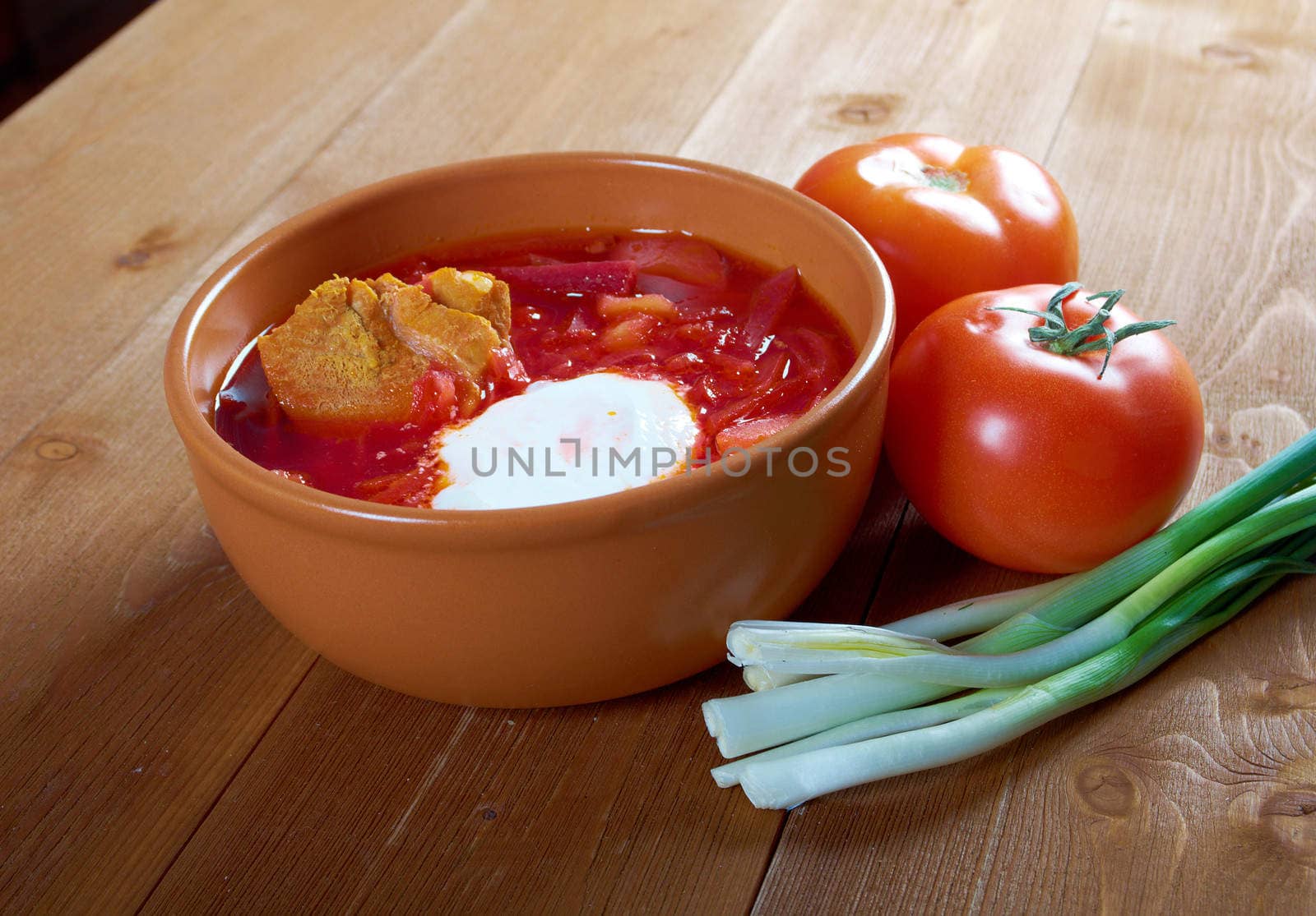 ukrainian and russian red-beet soup (borscht) with garlic and sour cream