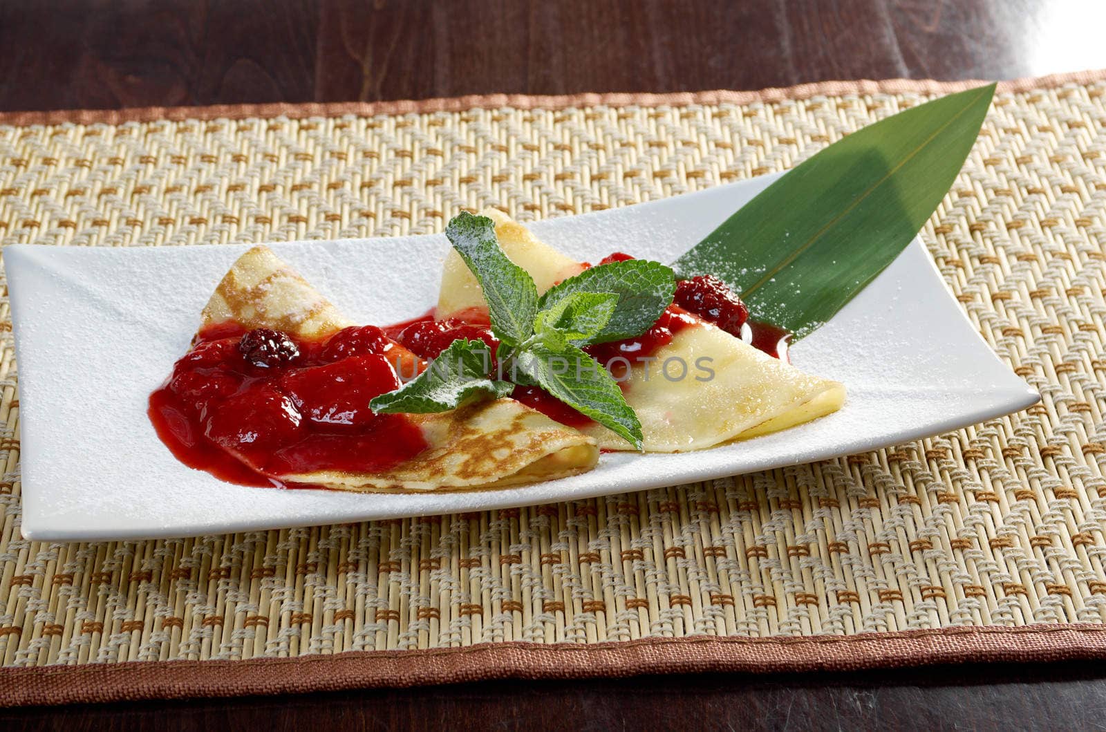 Pancakes with strawberry jam.closeup