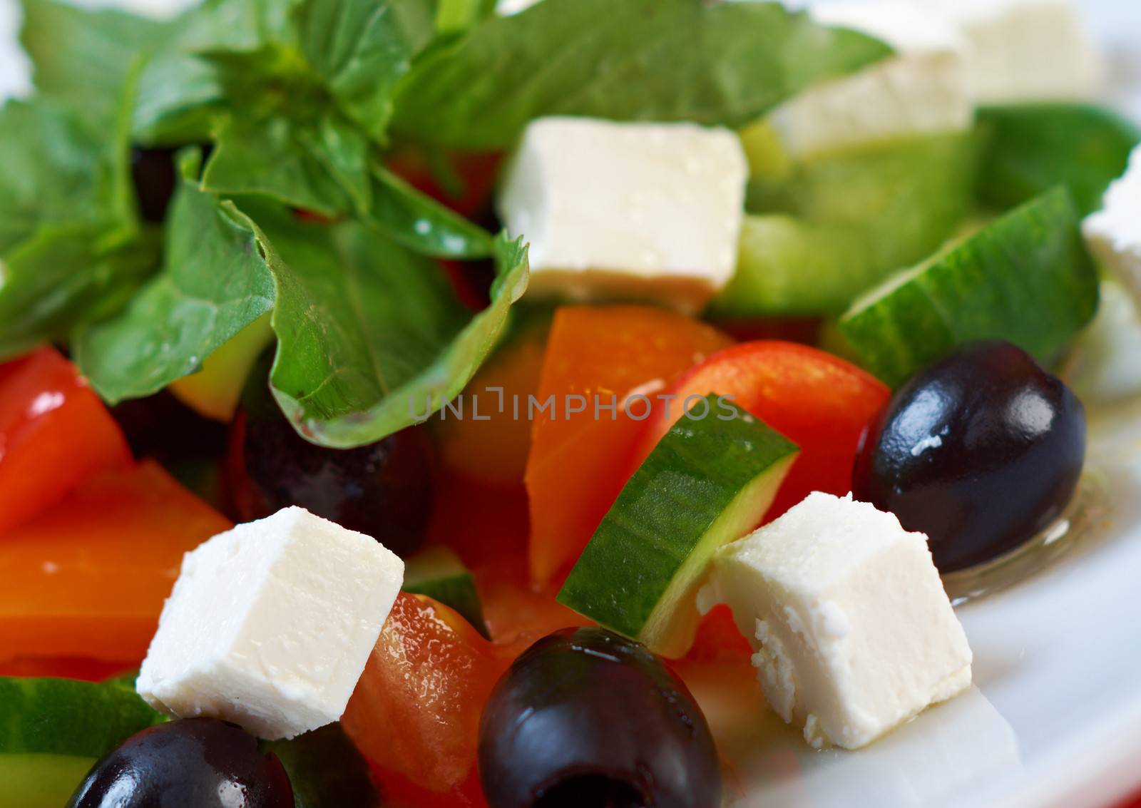 Greek salad with feta, tomatoes and black olives . selective focus