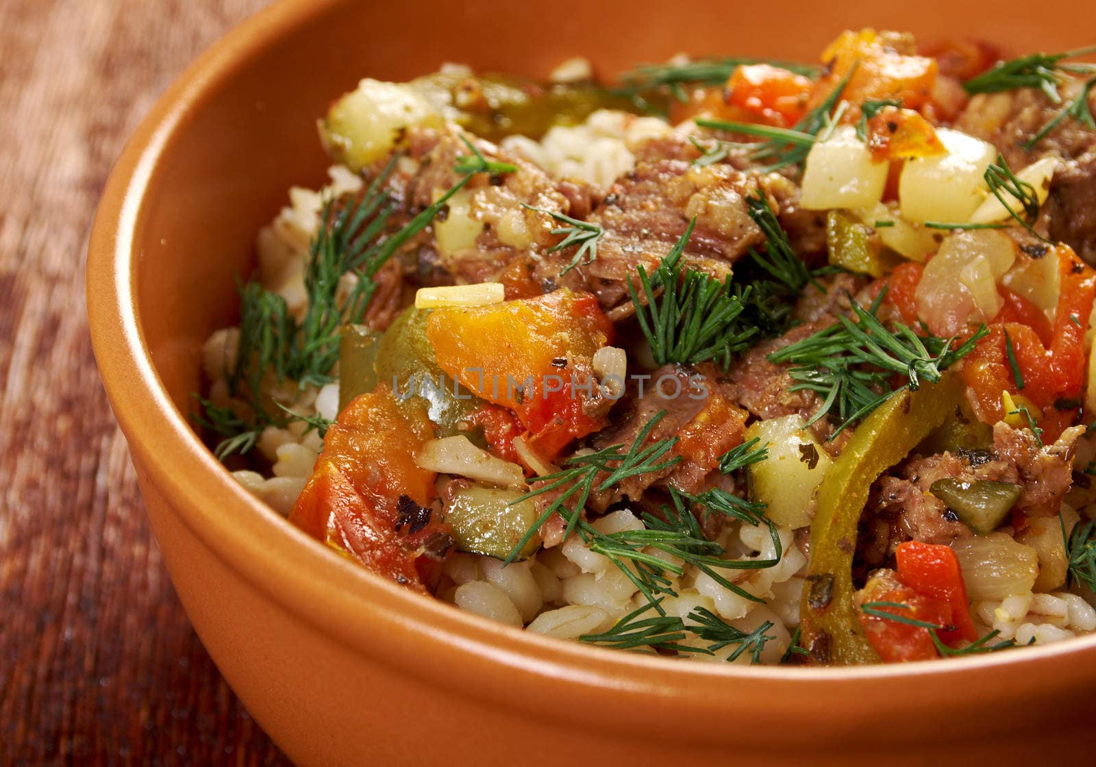 boiled pearl barley with meat and vegetable .farm-style 	country