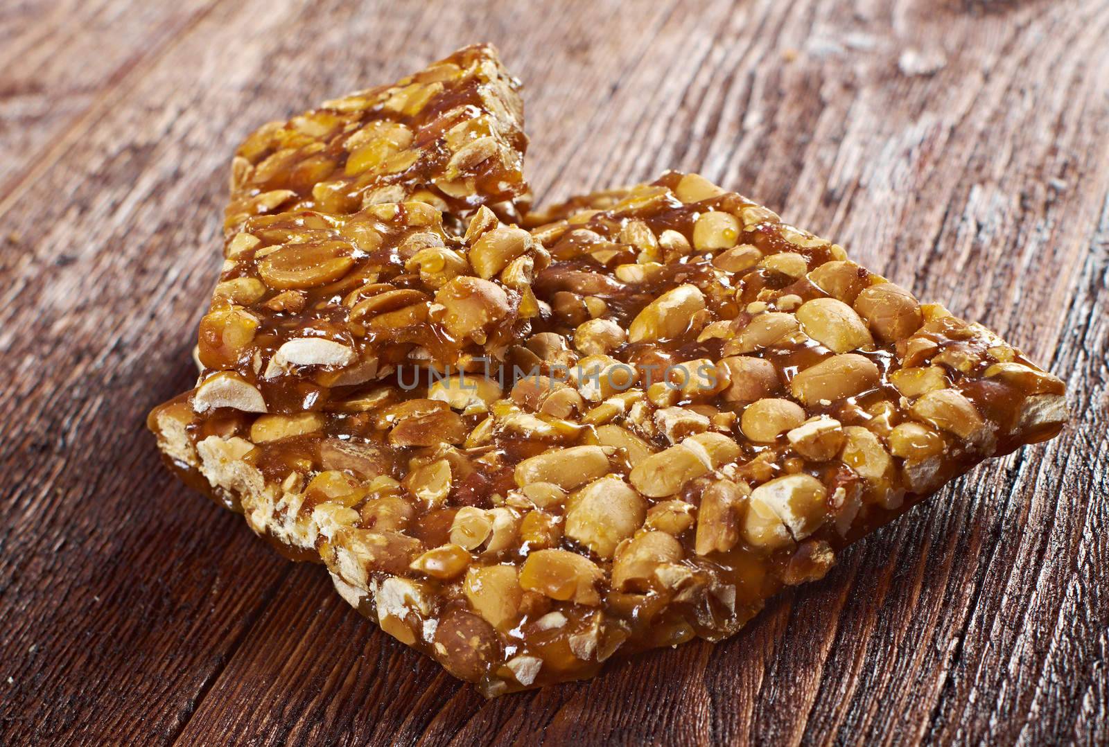 Peanut brittle sweet hard on wooden table