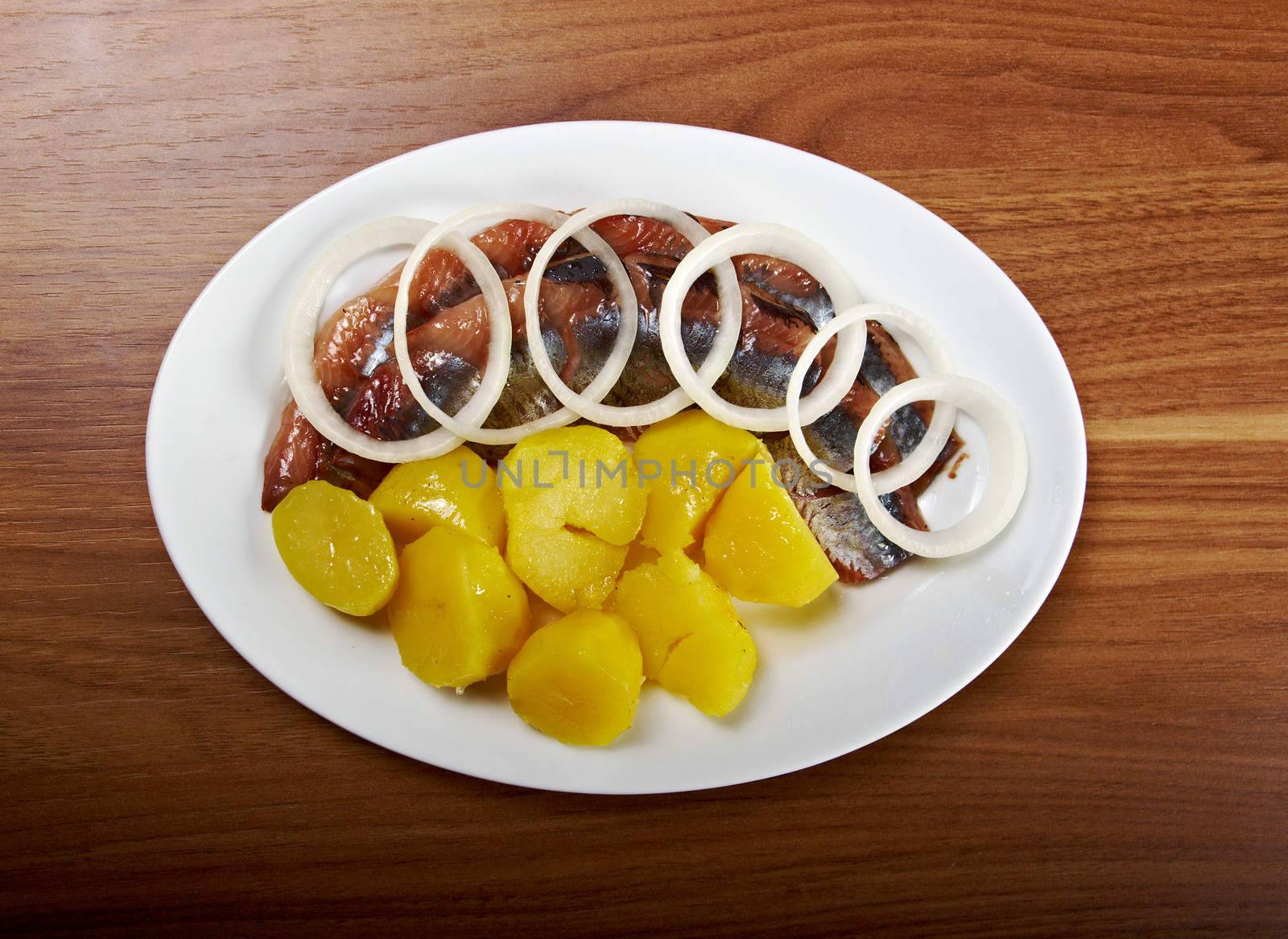 herring fish fillets with potato and onion