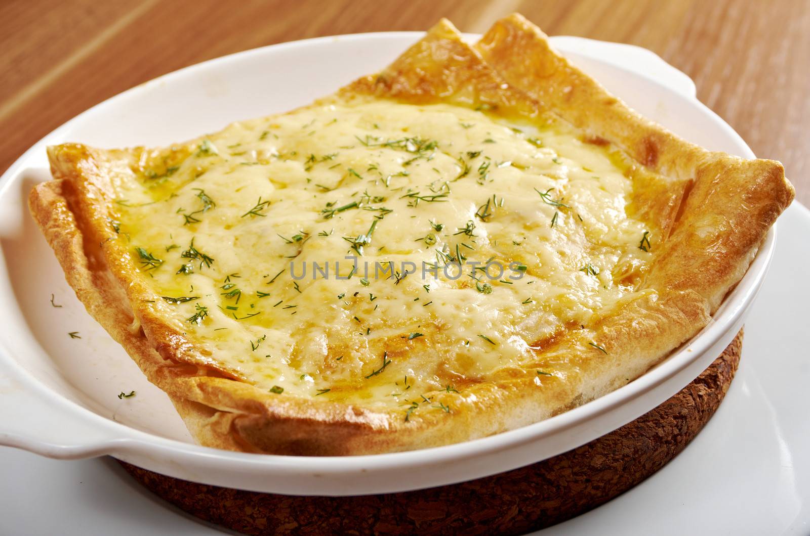 Qutab - baked lavash cheese pie .georgian bread and cheese suluguni 