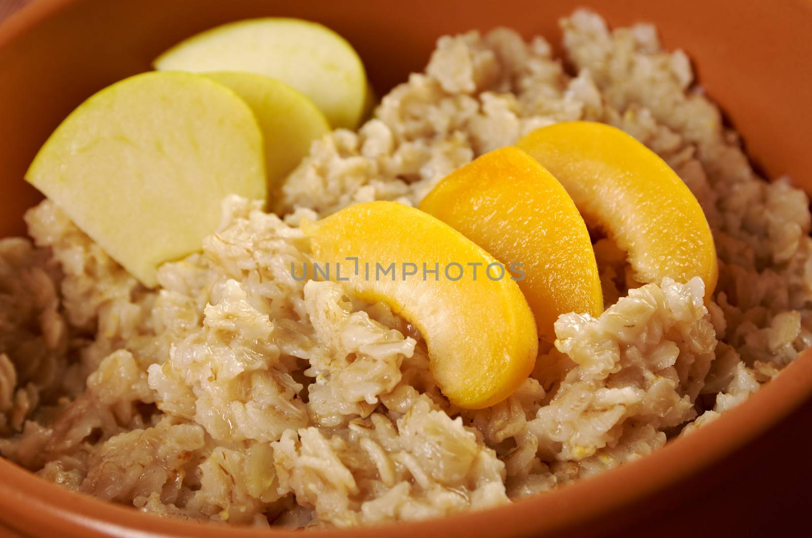 Oat porridge with  fruit, selective focus