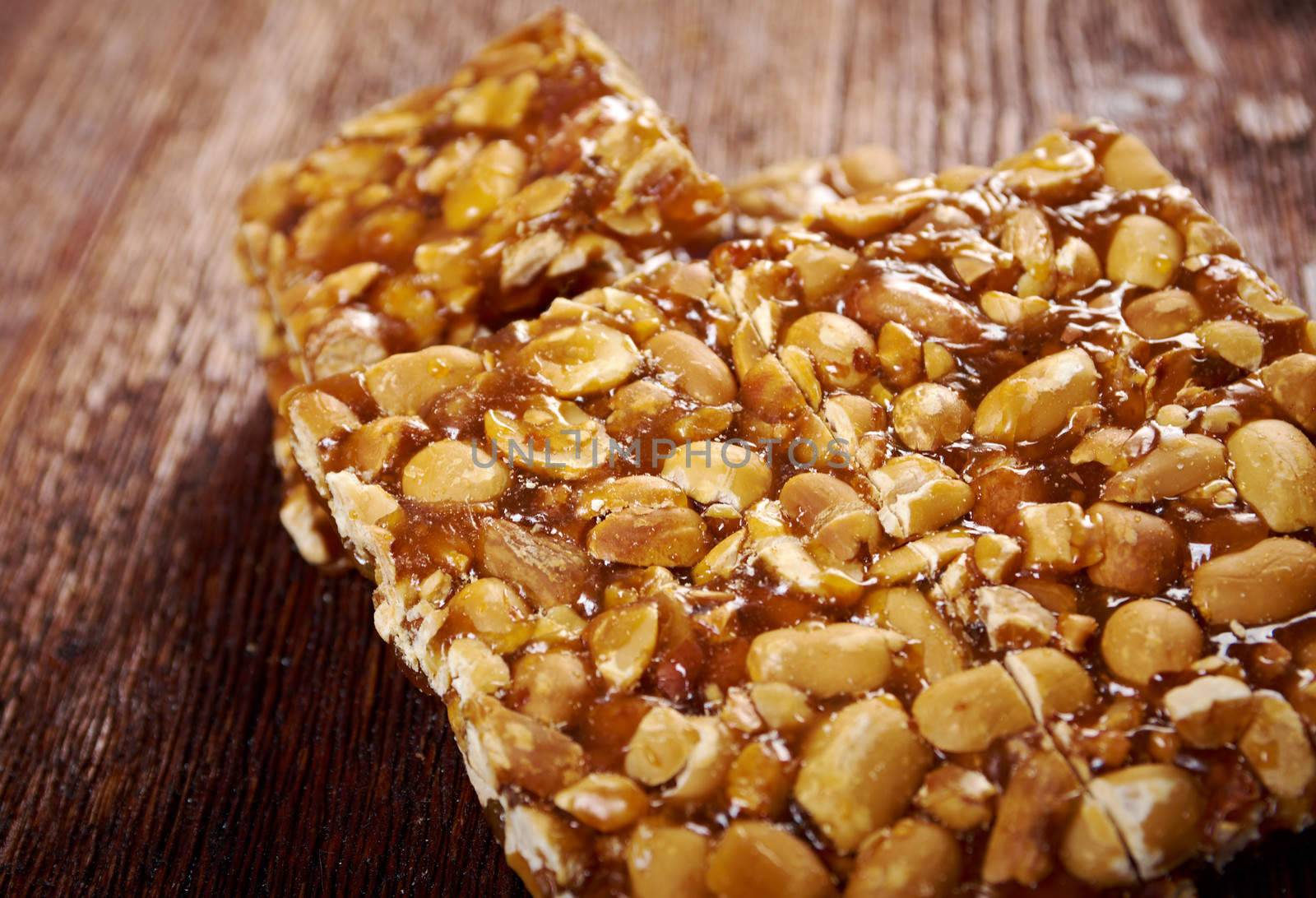 Peanut brittle sweet hard on wooden table