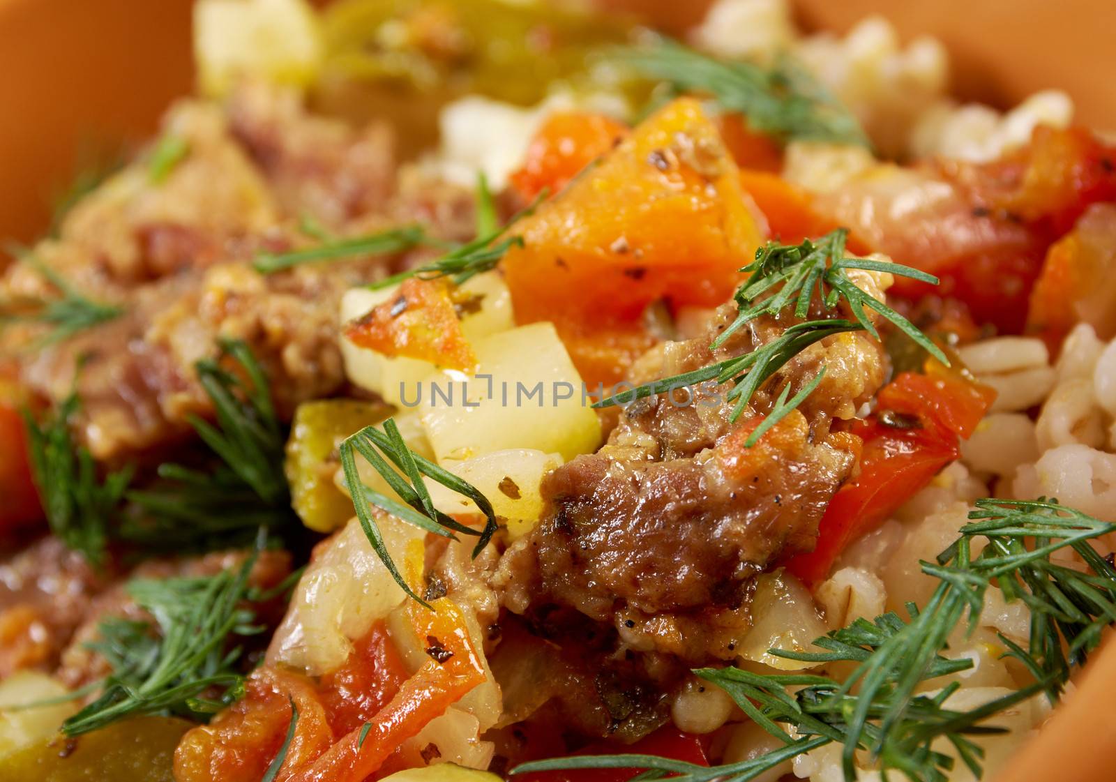 boiled pearl barley with meat and vegetable .farm-style 	country