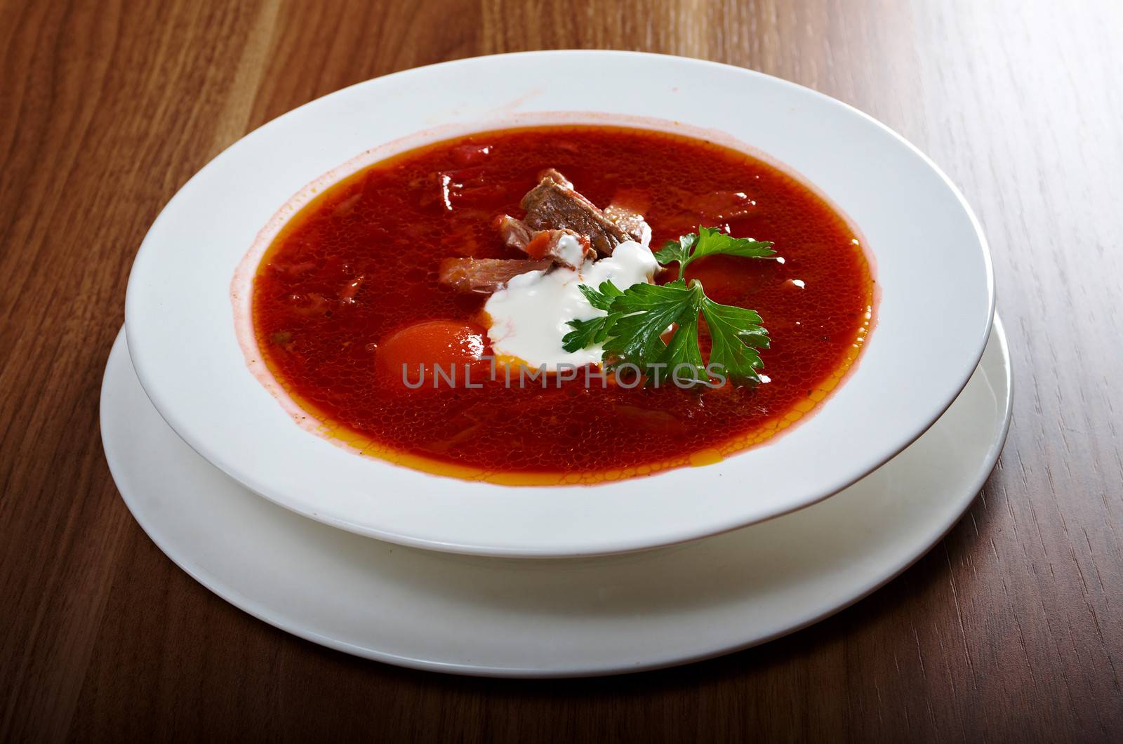 ukrainian and russian red-beet soup (borscht) with garlic and sour cream