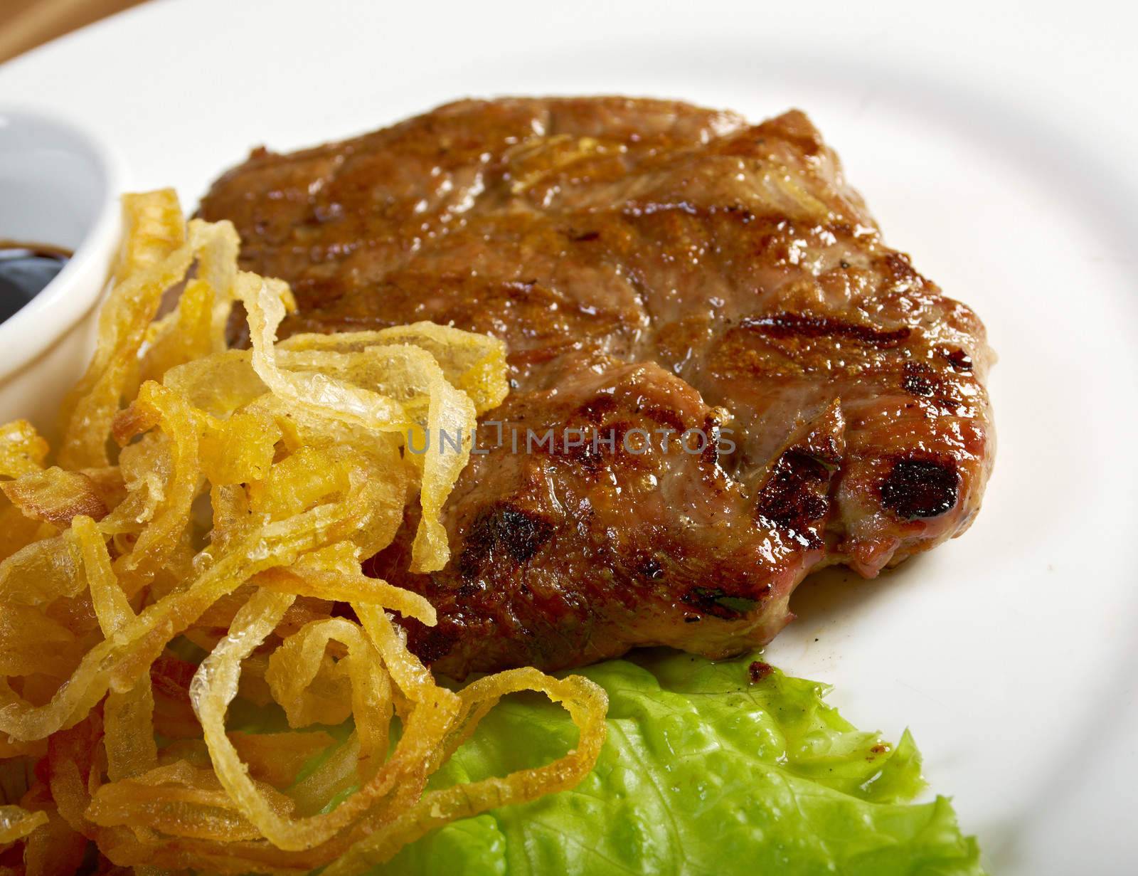 grilled t-bone  beef steak and vegetables