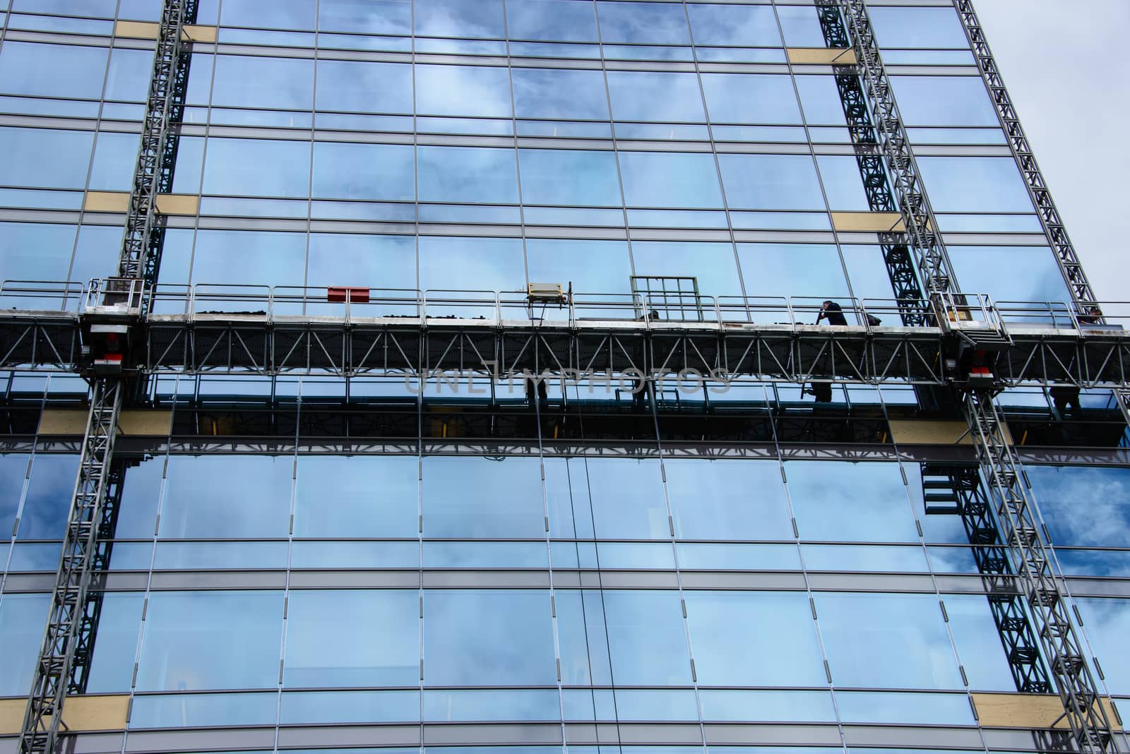 Facade work on a skyscraper made of glass