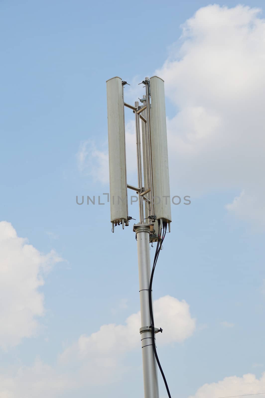 Telecommunications pole with blue sky