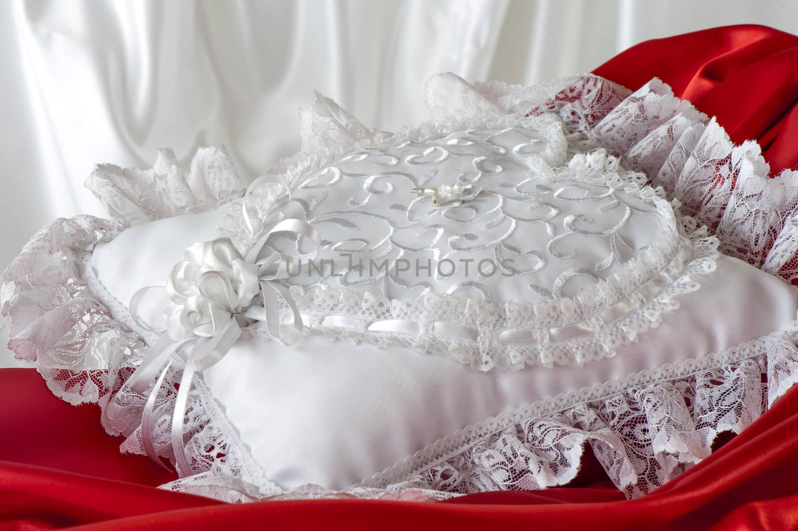 a white pillow for a wedding rings