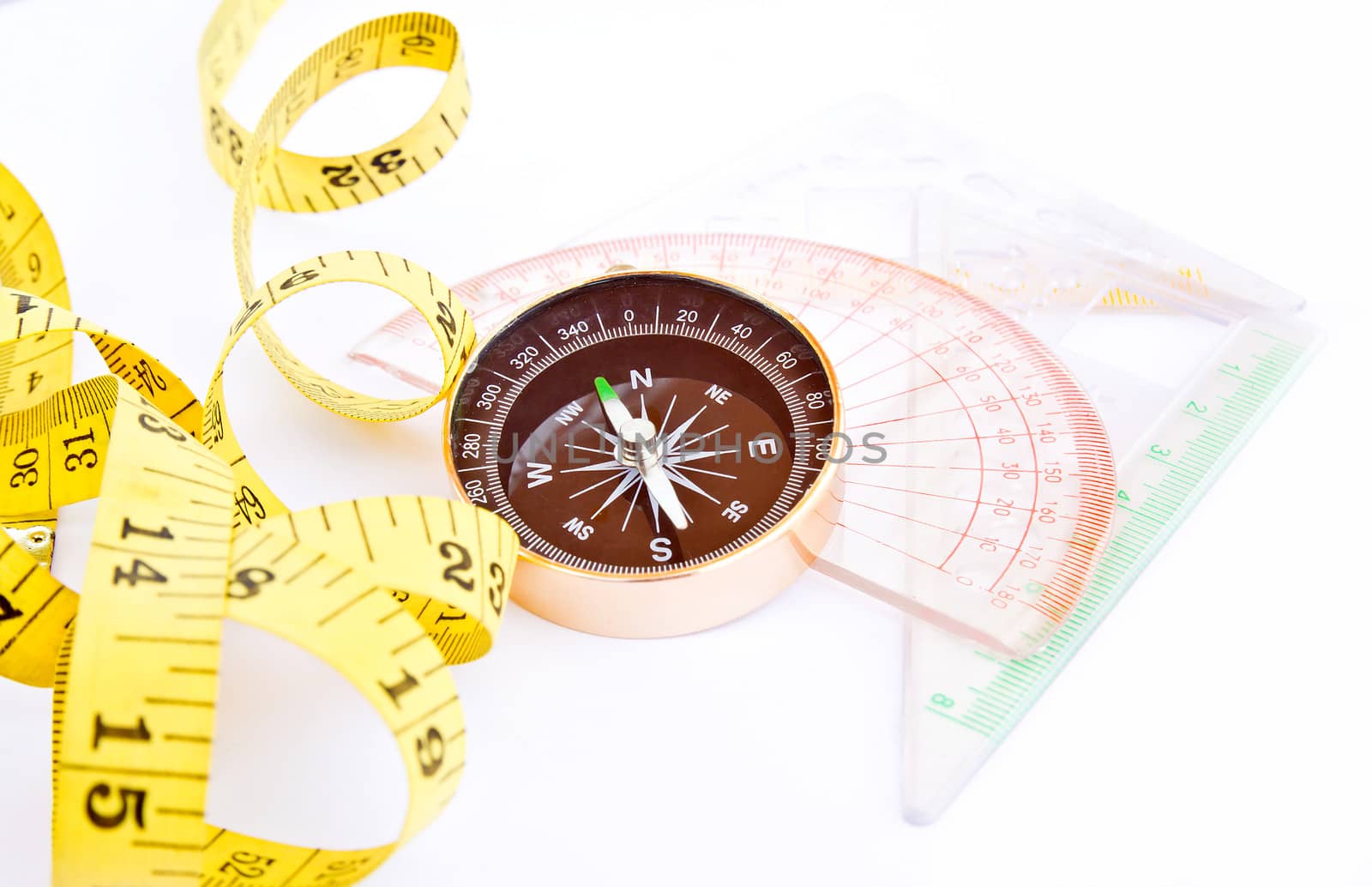 Measure Tape, Compass, ruler on white background