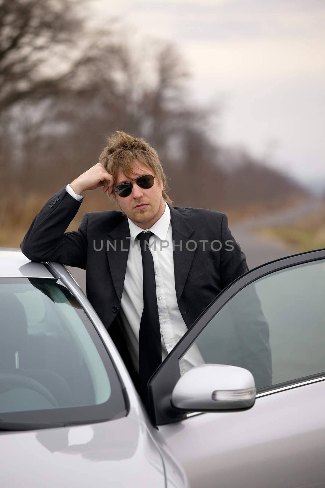 Driver of a car standing and waiting