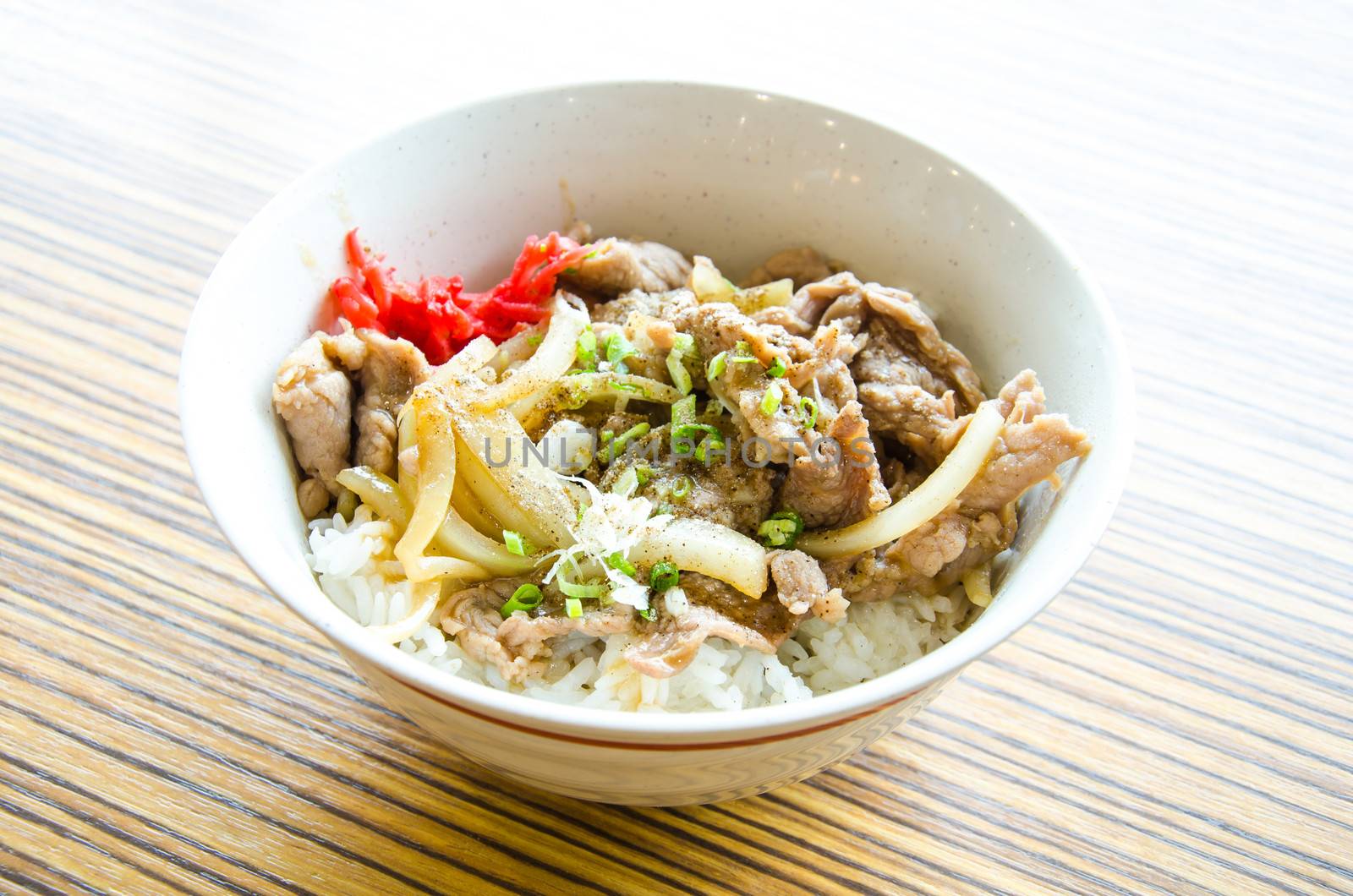 Gyudon, beef bowl, is a Japanese dish consisting of a bowl of rice topped with beef and onion simmered in a mildly sweet sauce flavored