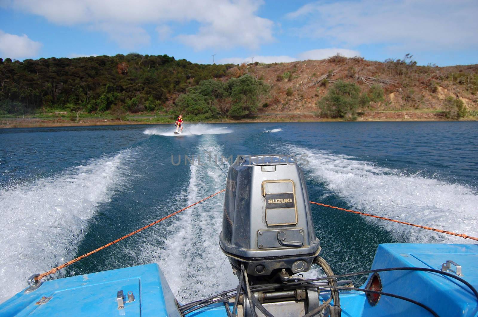 Wakeboarding at lake motor boat view, North Island, New Zealand