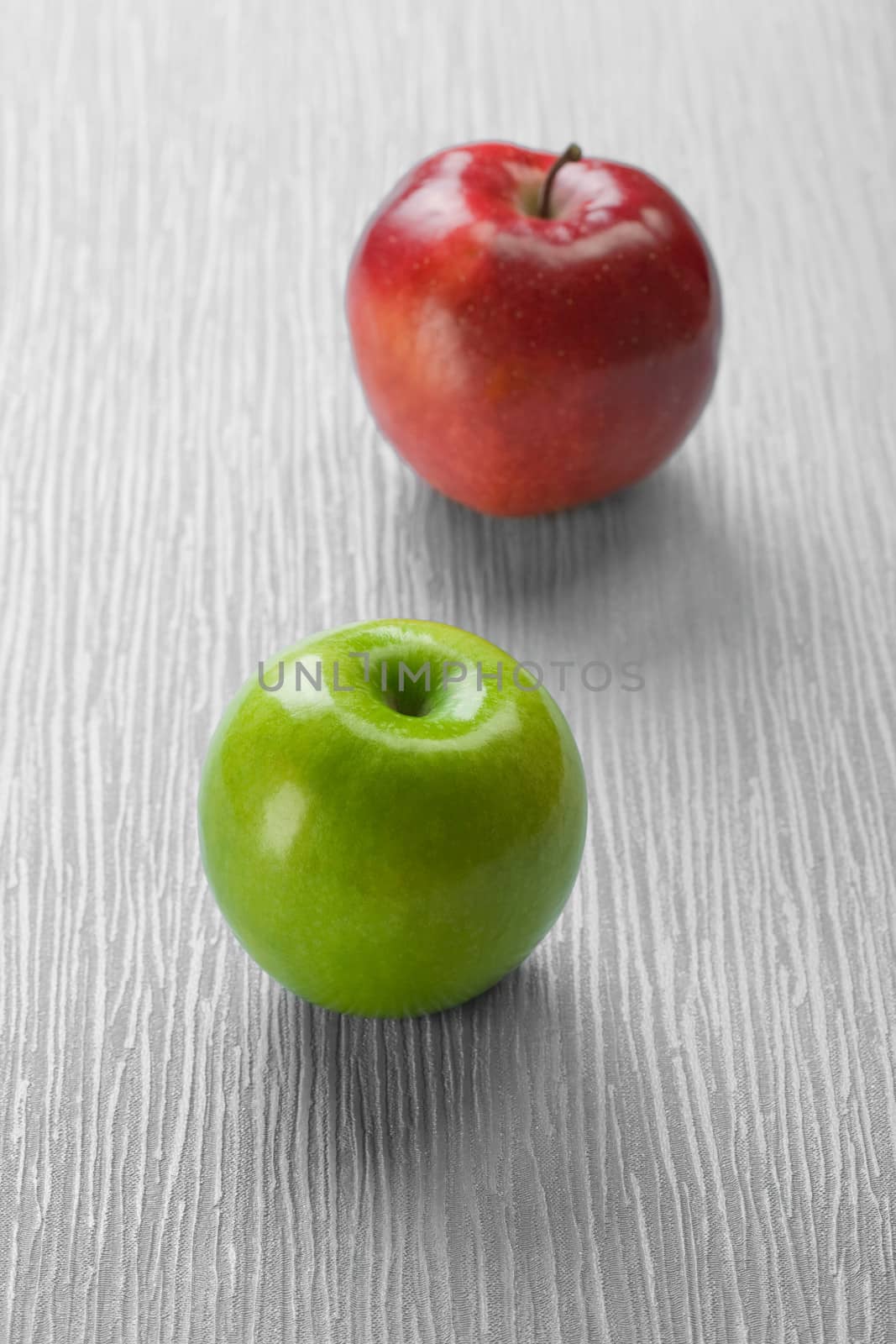 two apples on abstract background