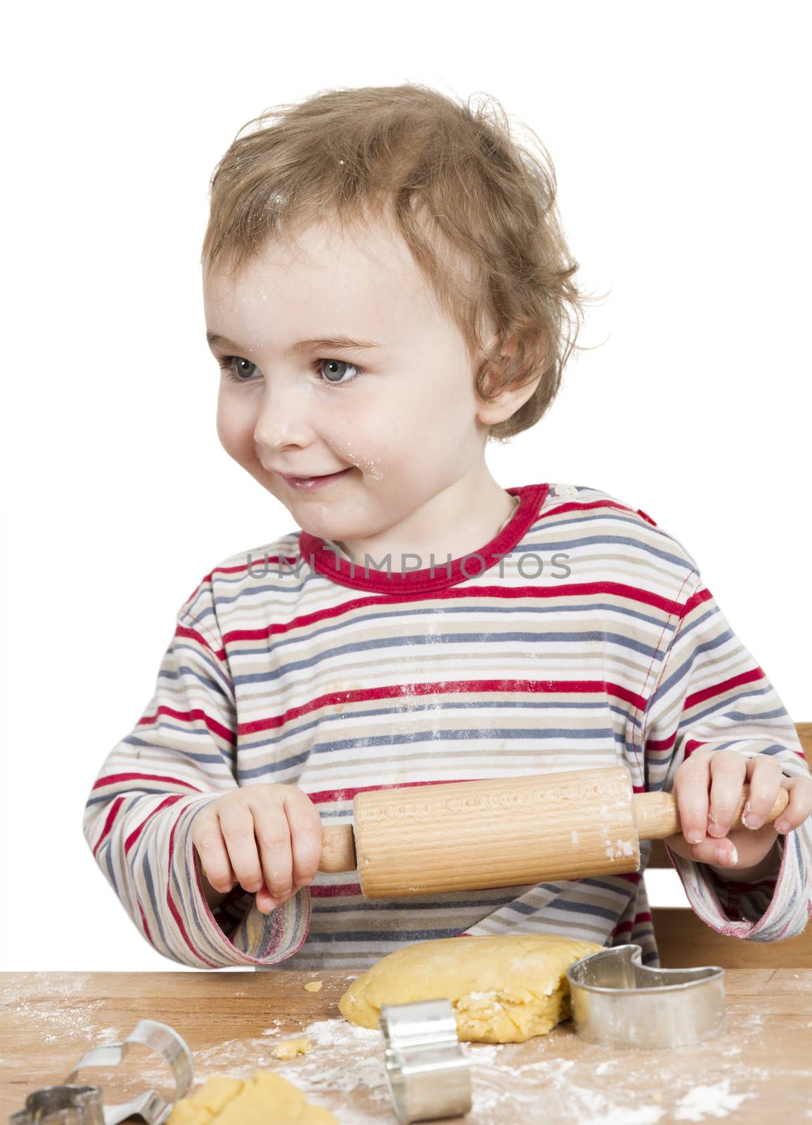 cute, laughing child with dough and rolling ping isolated on white background. horizontal image