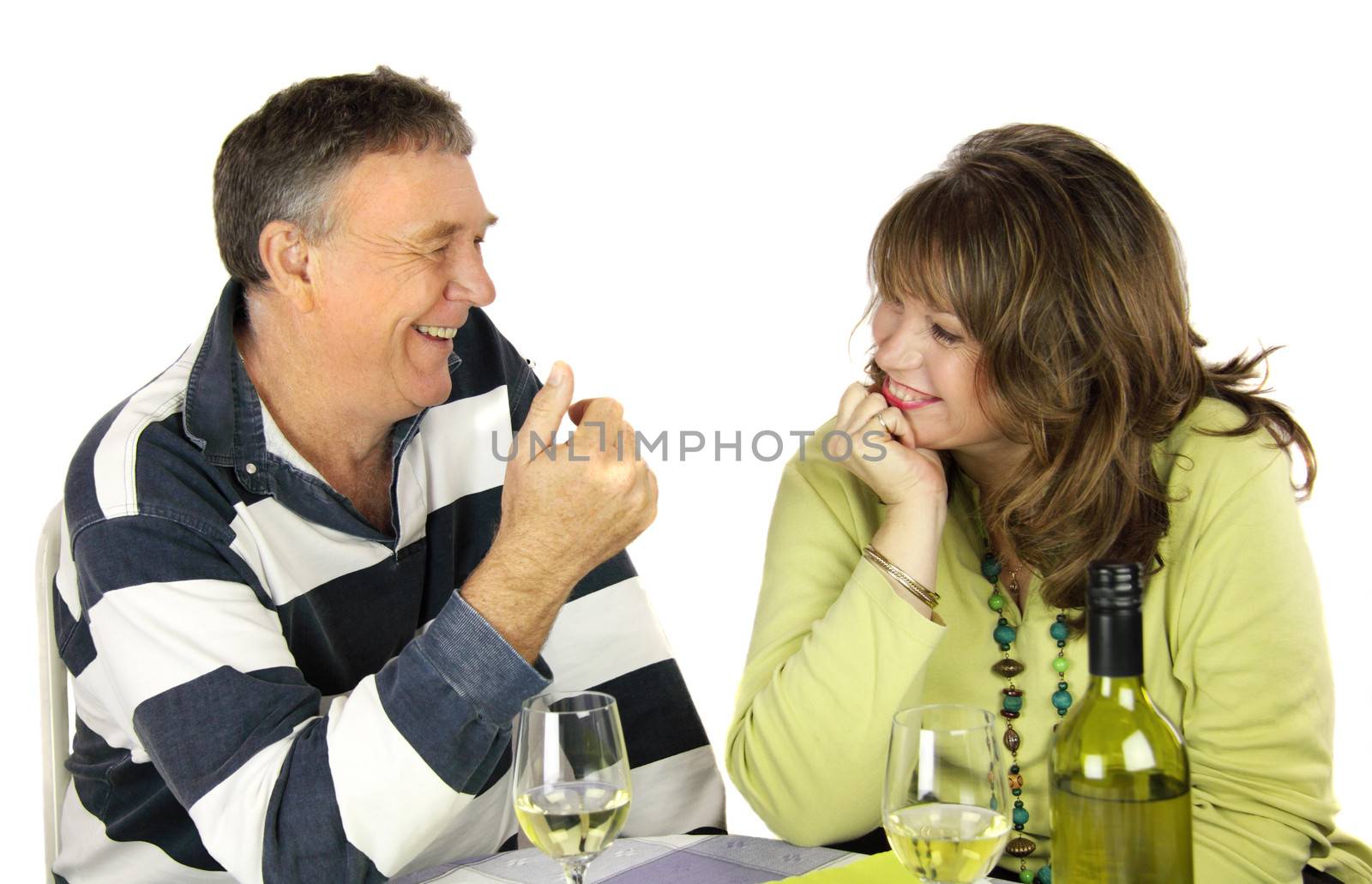 Middle aged couple having a conversation over lunch.