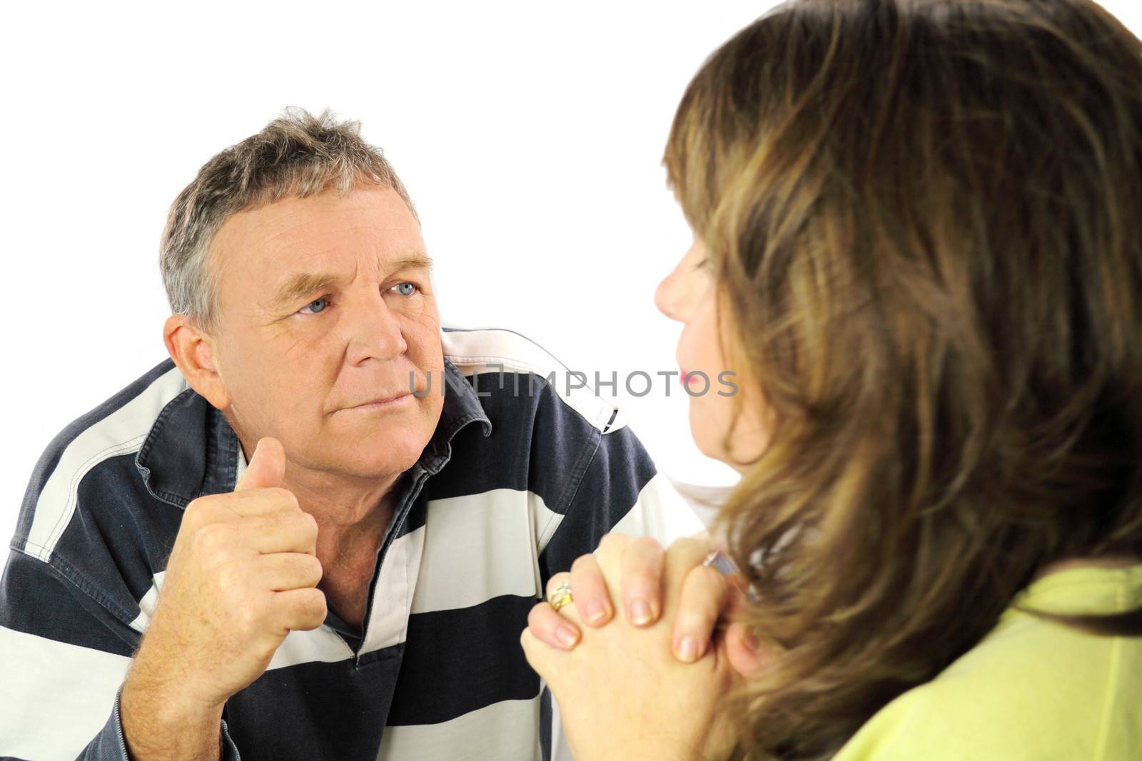 Upset and emotional middle aged couple after an argument.