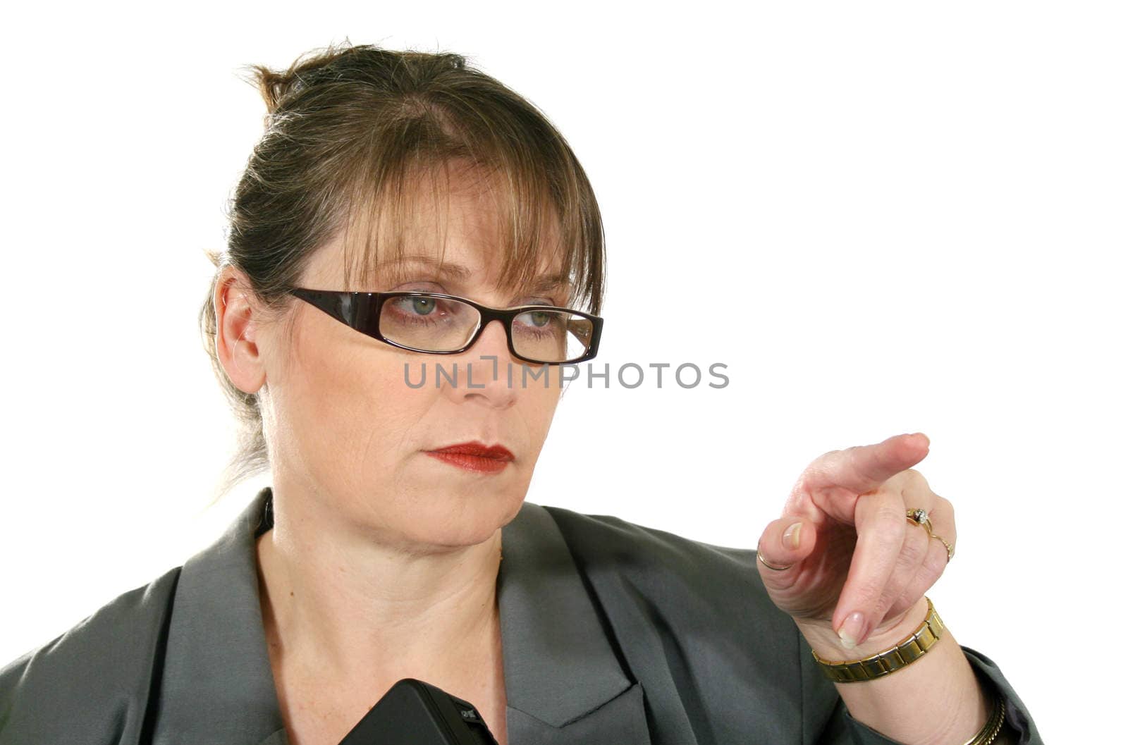 Serieous middle aged businesswoman gesticulating and pointing.