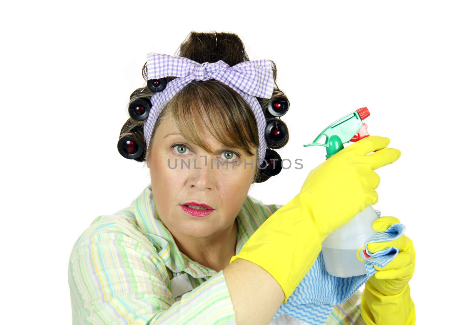 Frumpy housewife prepares for action with the spray bottle.