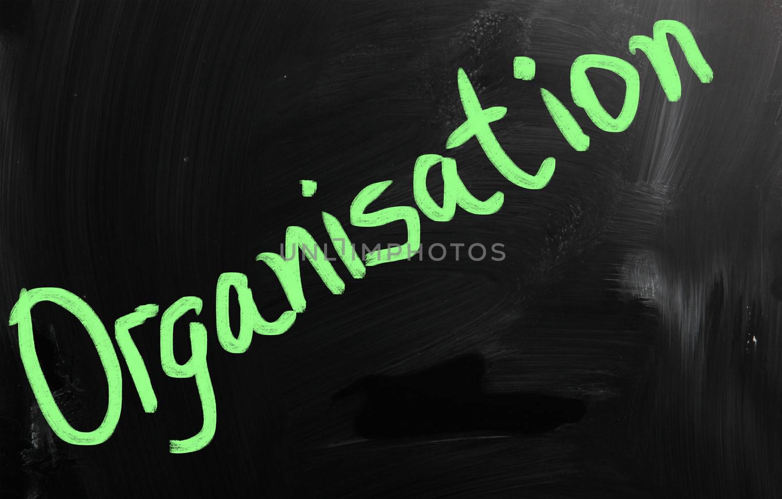 "Organisation" handwritten with white chalk on a blackboard