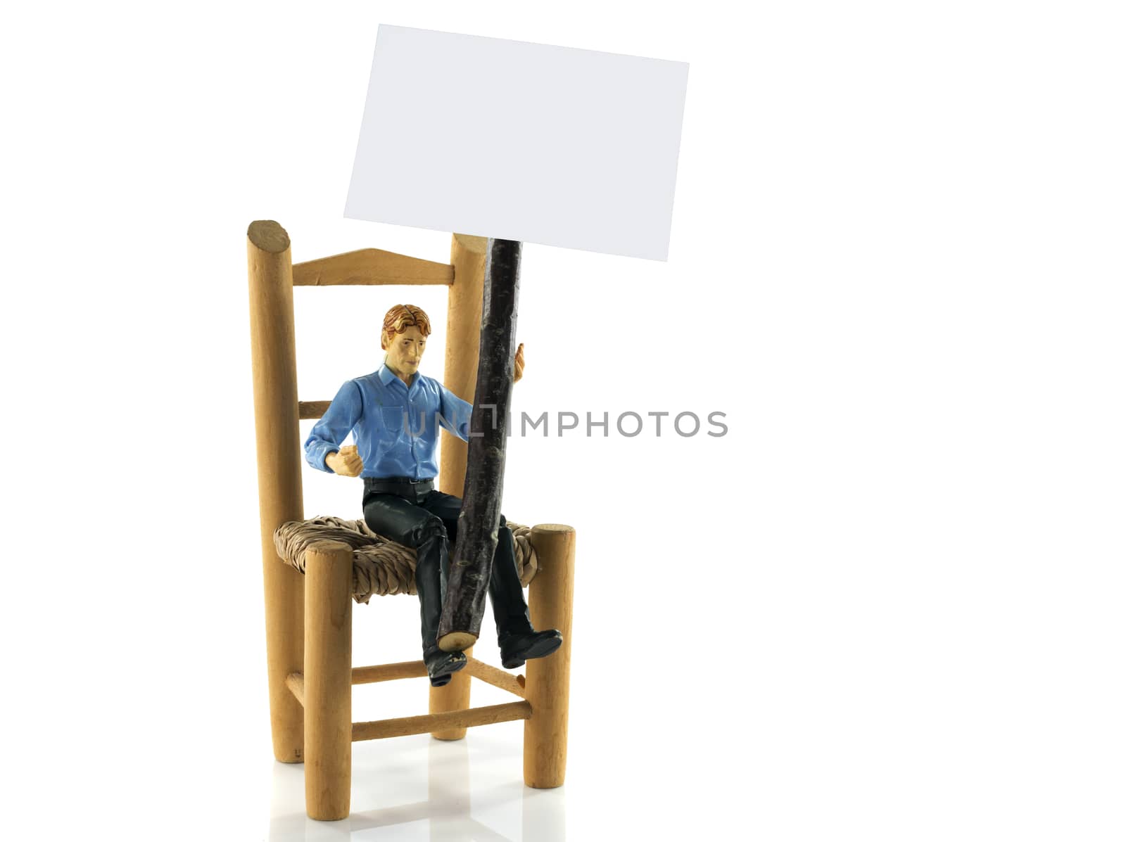 puppet toy man sitting on chair with information board