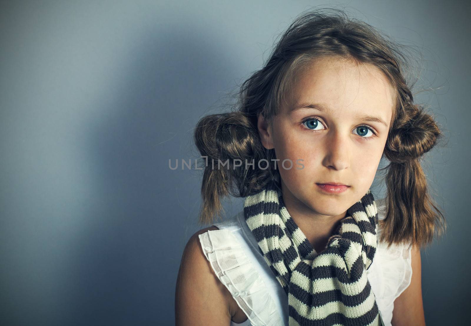 Image of young stylish grl looking at camera