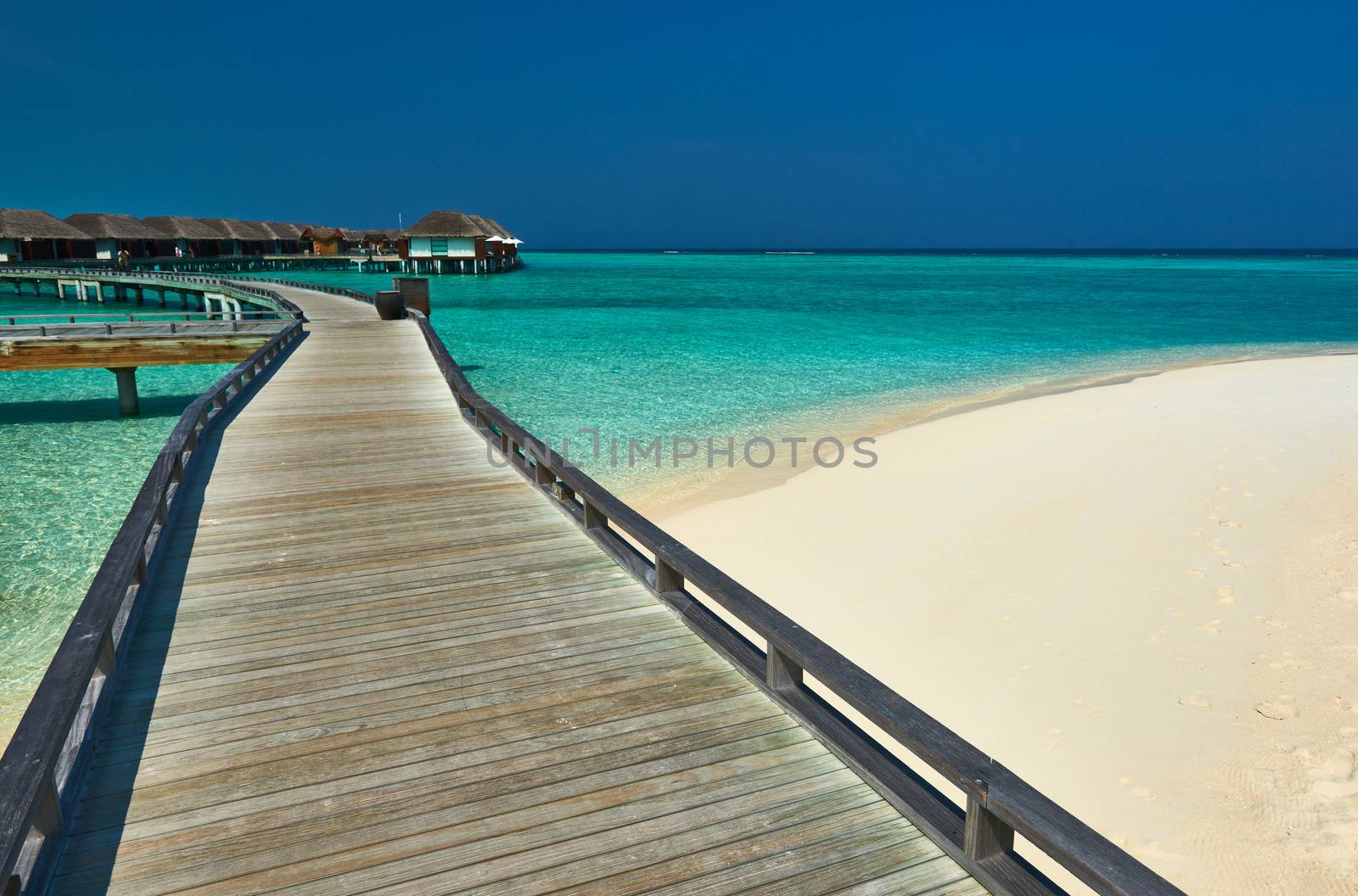 Beautiful beach with water bungalows at Maldives