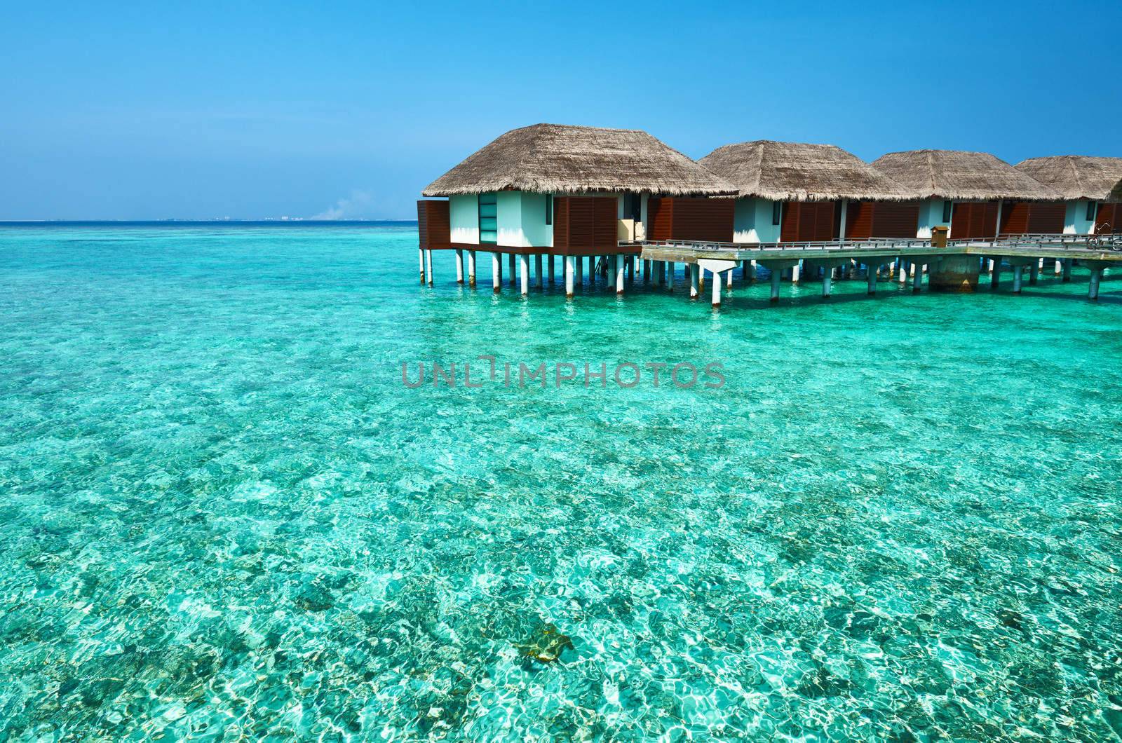 Beautiful beach with water bungalows at Maldives