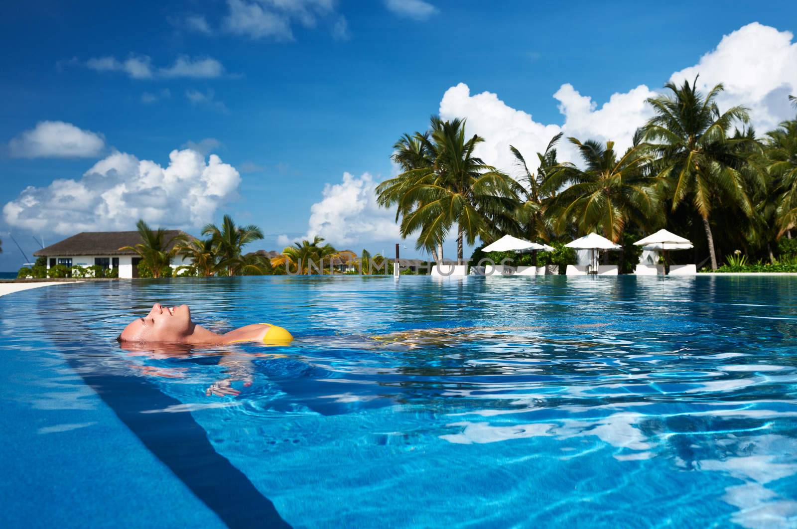 Woman at poolside by haveseen