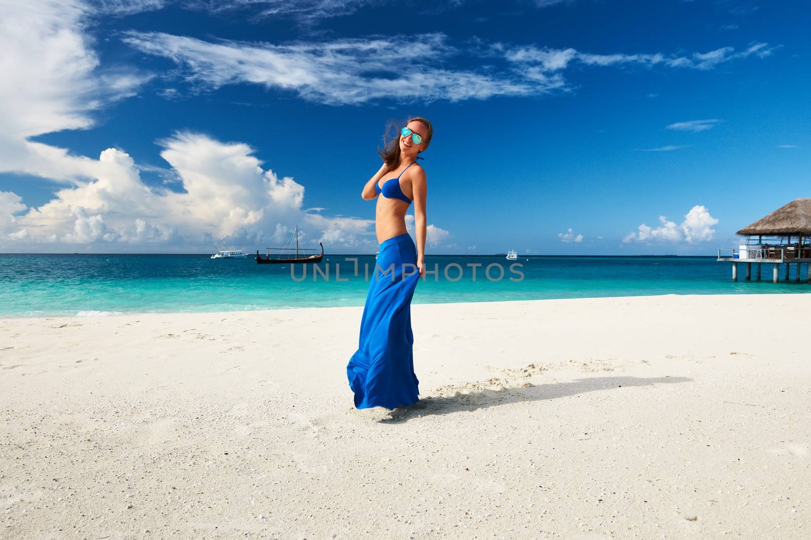 Woman in skirt at tropical beach