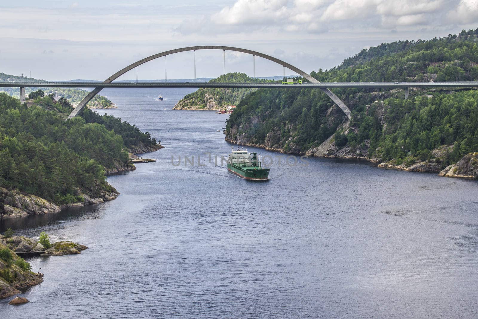 Cargo ship Kalkvik  going to the port of Halden, Norway in order to unload clay. The picture is shot from Svinesund Bridge.