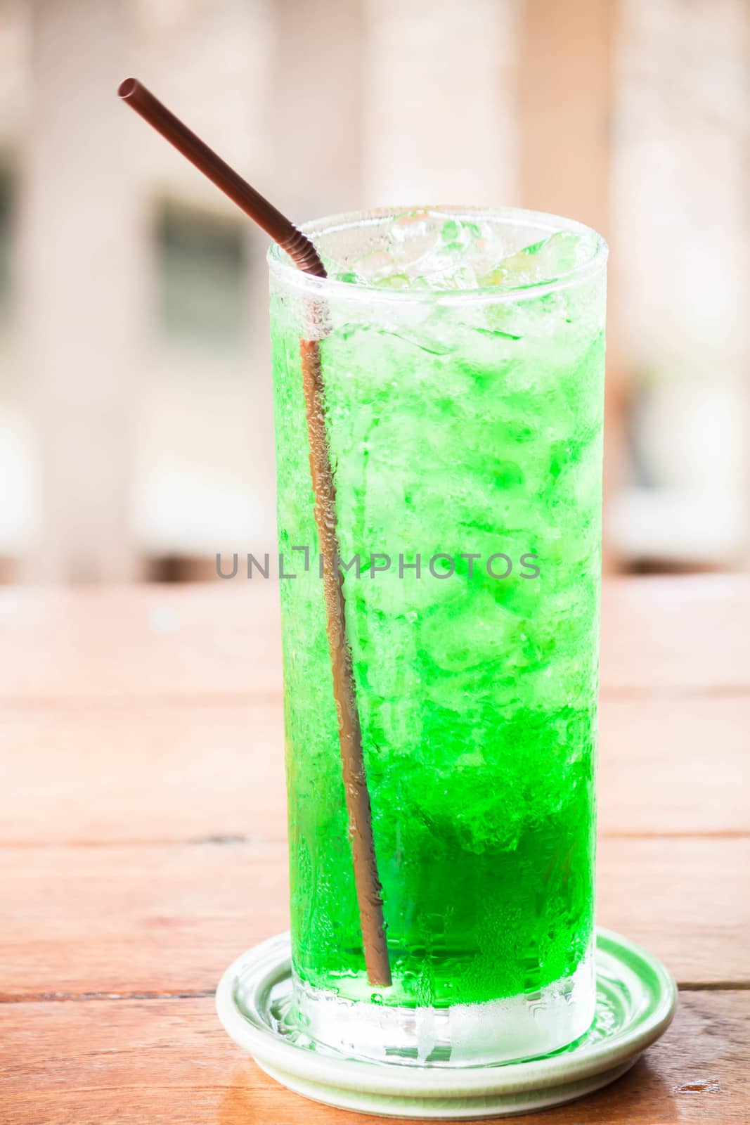 Relaxing with iced green drink on table