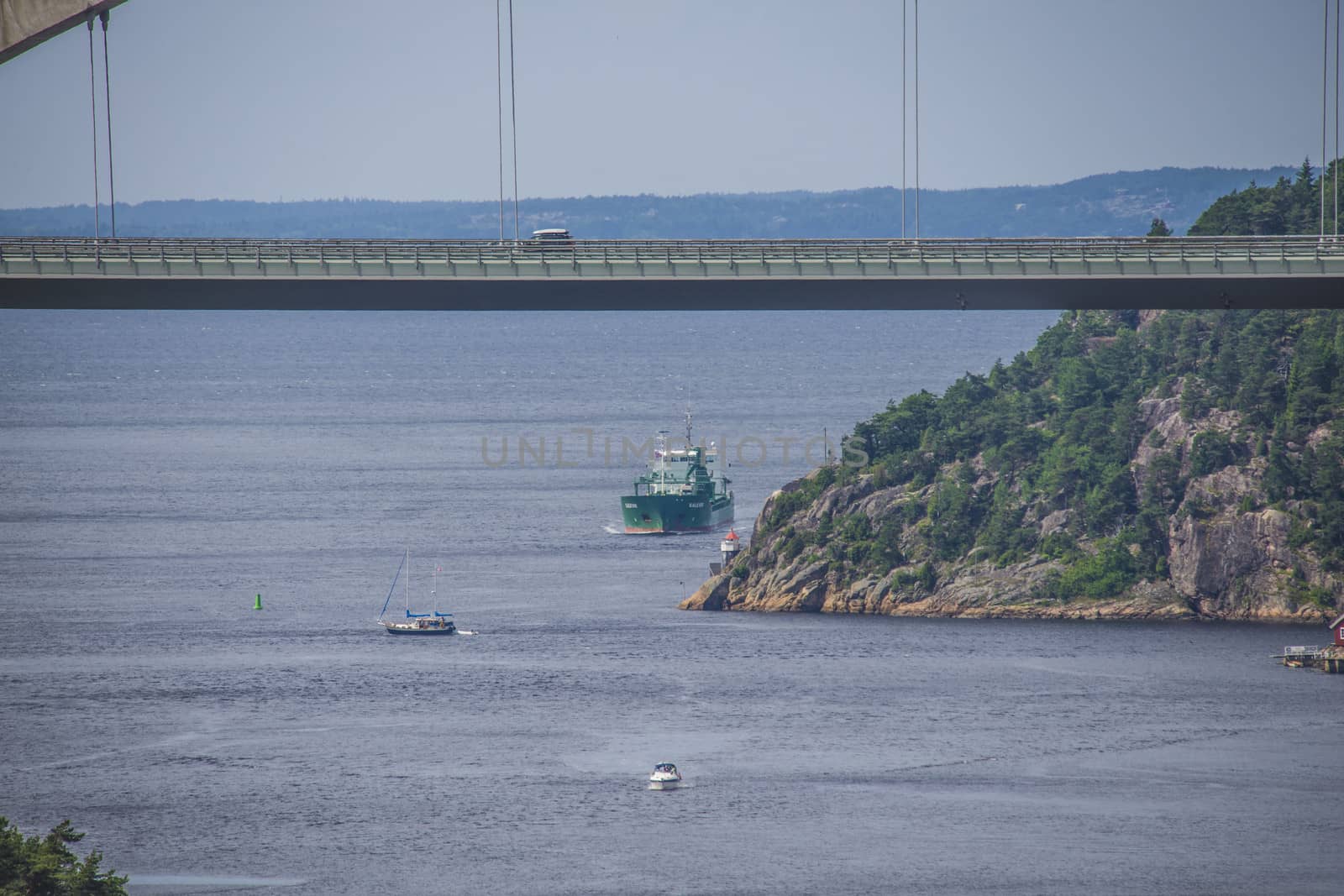 Cargo ship Kalkvik  going to the port of Halden, Norway in order to unload clay. The picture is shot from Svinesund Bridge.