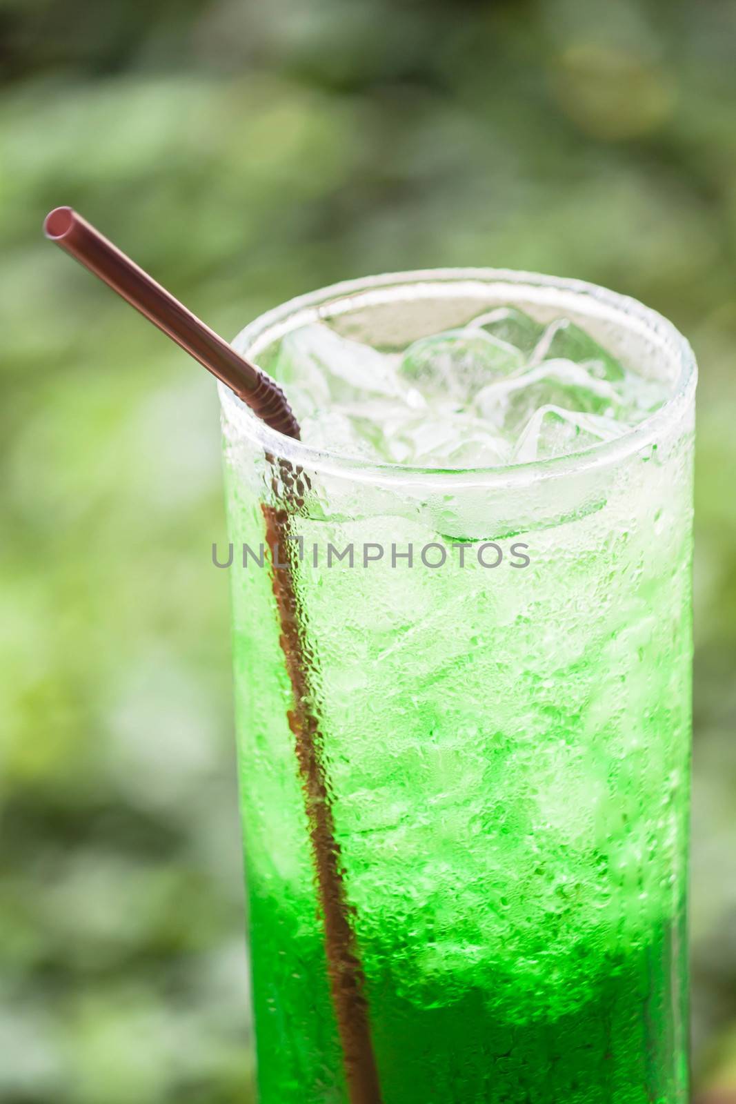 Non alcohol green drink with ice cubes