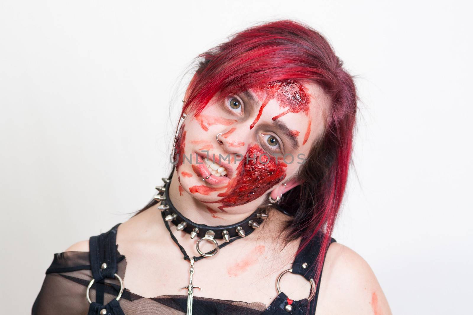 Red haired gothic girl with halloween makeup