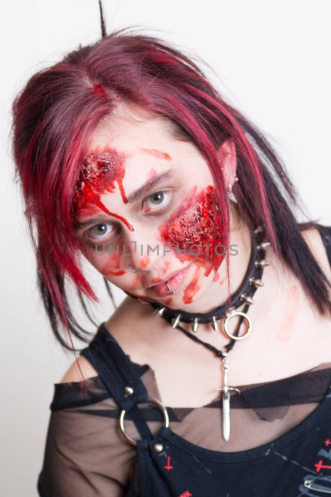 Red haired gothic girl with halloween makeup