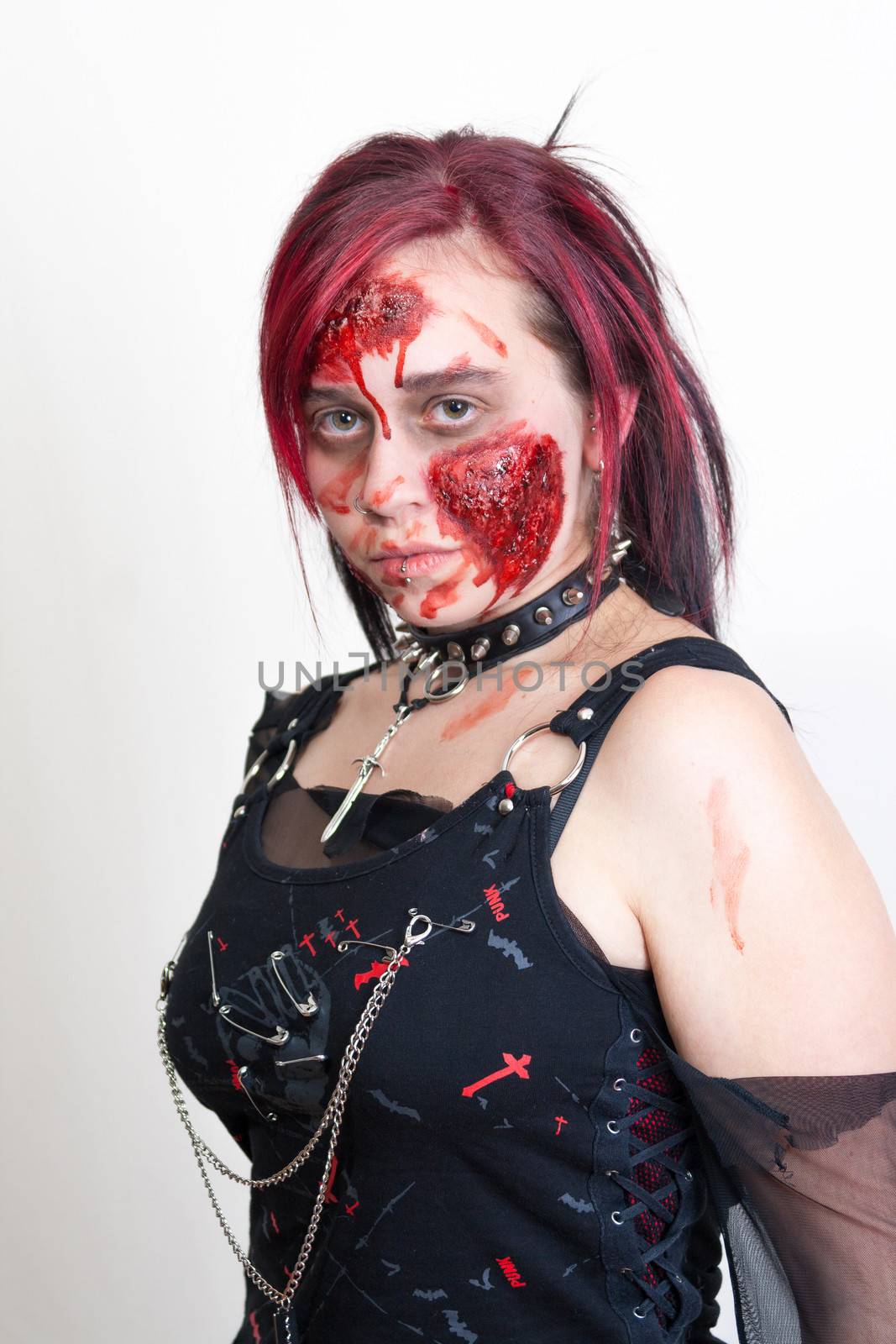 Red haired gothic girl with halloween makeup