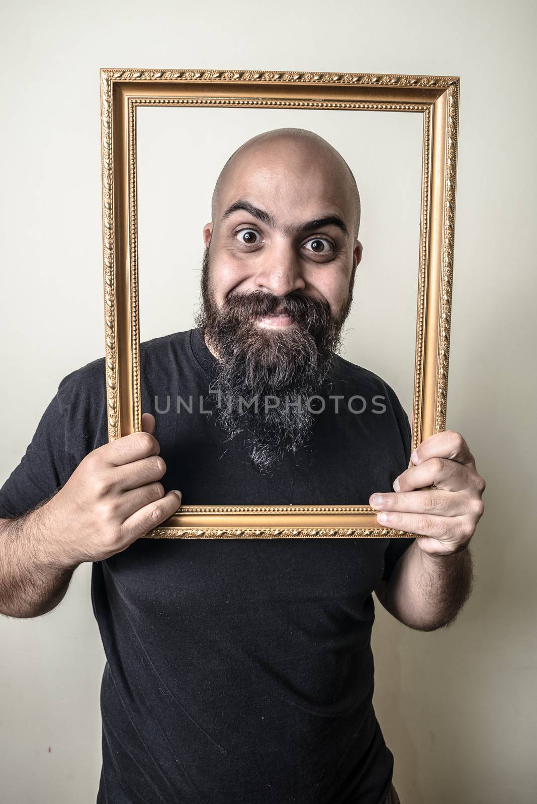 funny bearded man with golden frame by peus