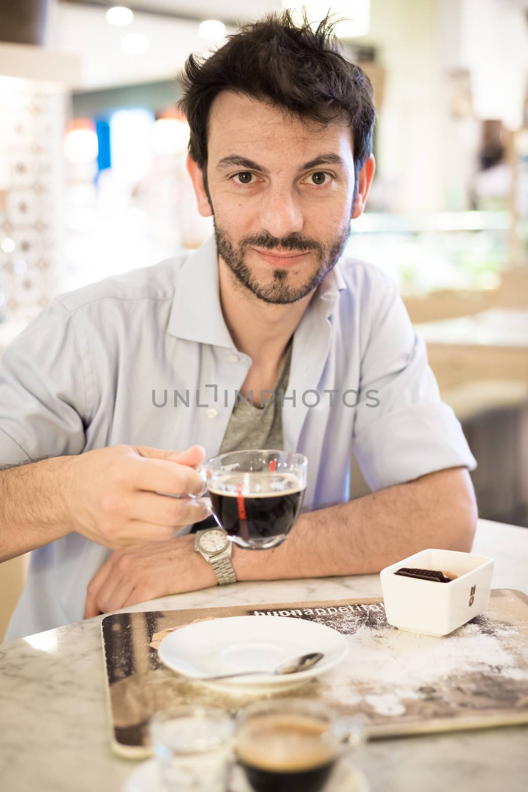 man at the bar drinking coffee by peus