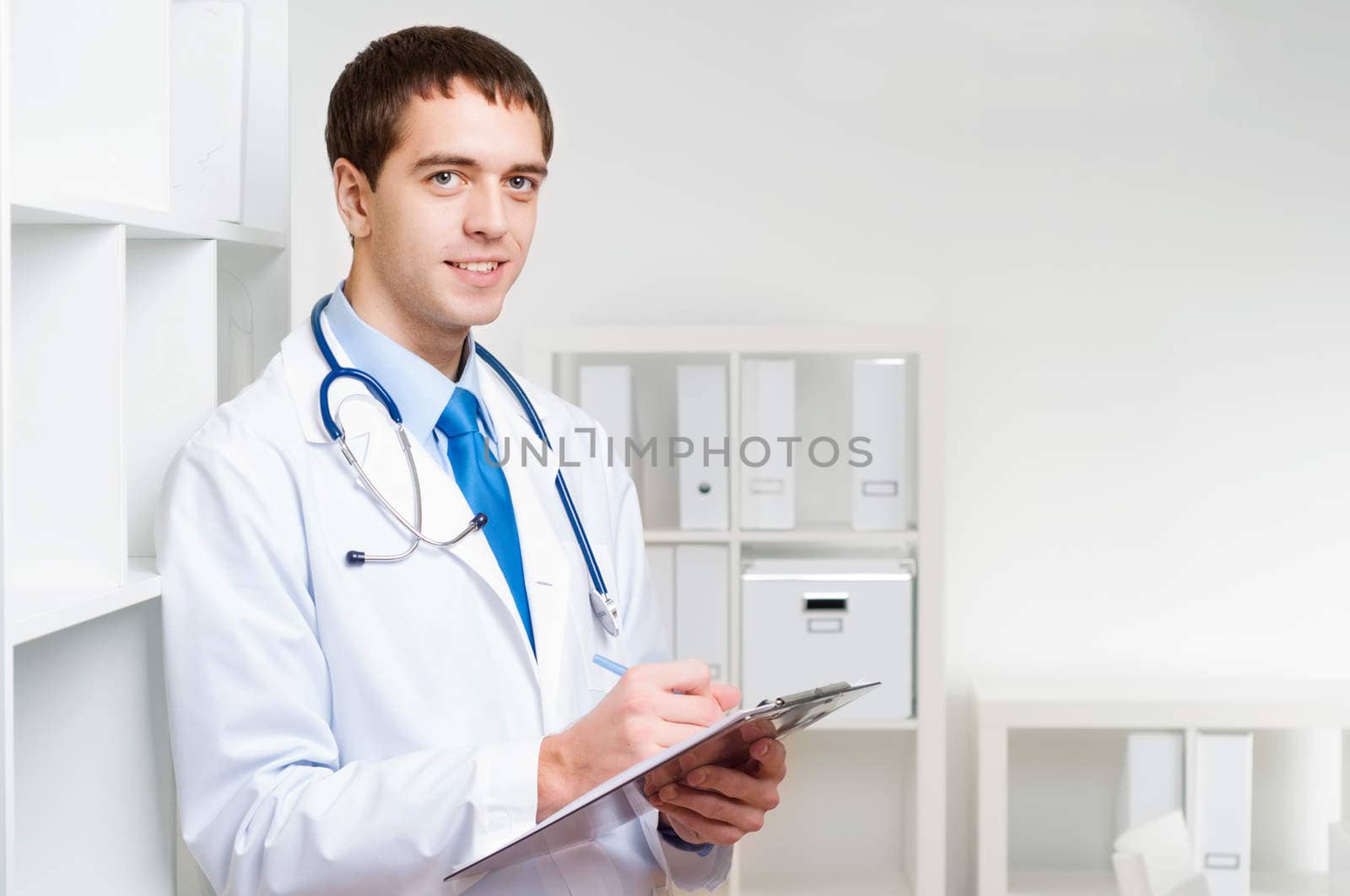 portrait of a doctor with a clipboard takes notes