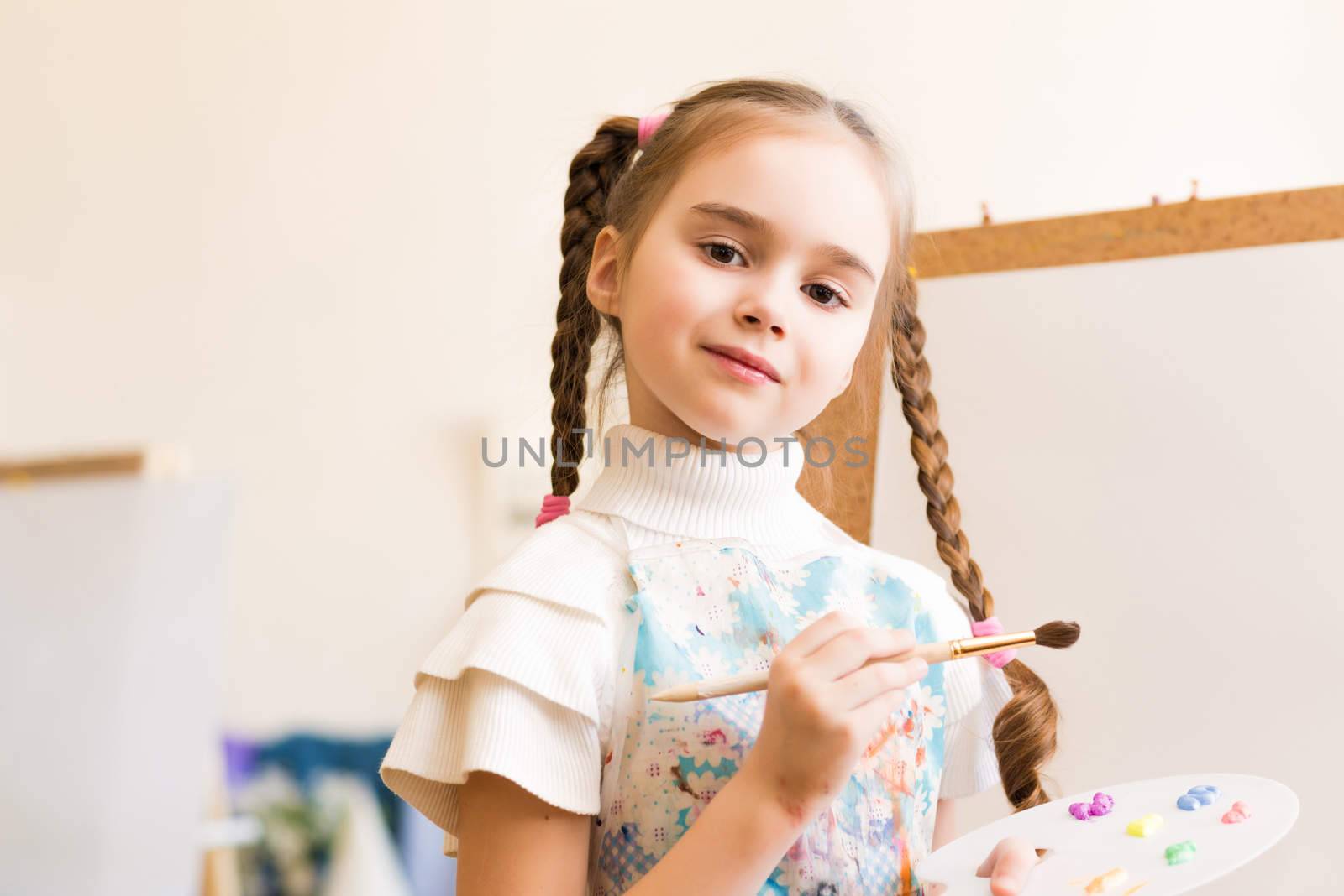 portrait of a girl standing next to his easel, a drawing lesson