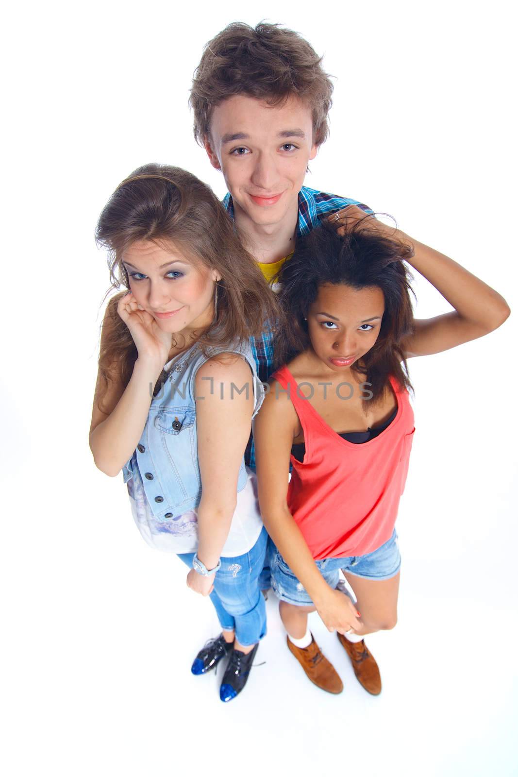 Three young happy teenagers grimacing. Isolated on white background.