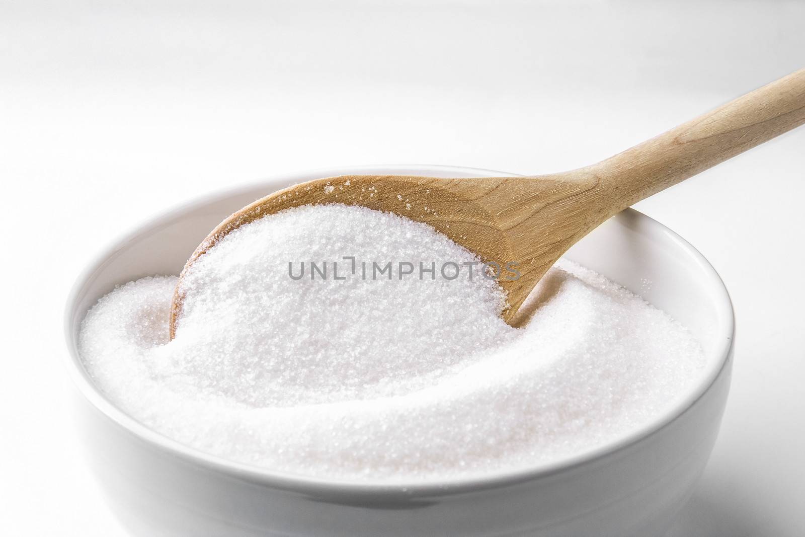 Wooden spoon with sugar by dynamicfoto