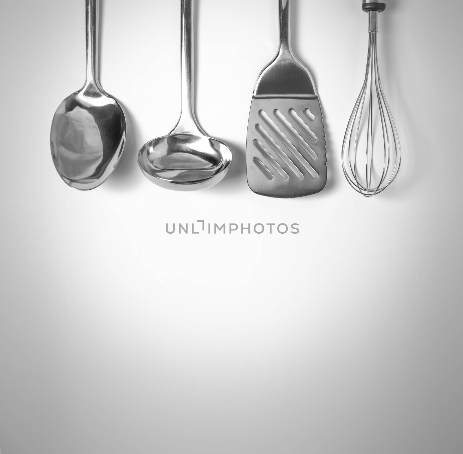 Set of kitchen tools hanged up in the wall