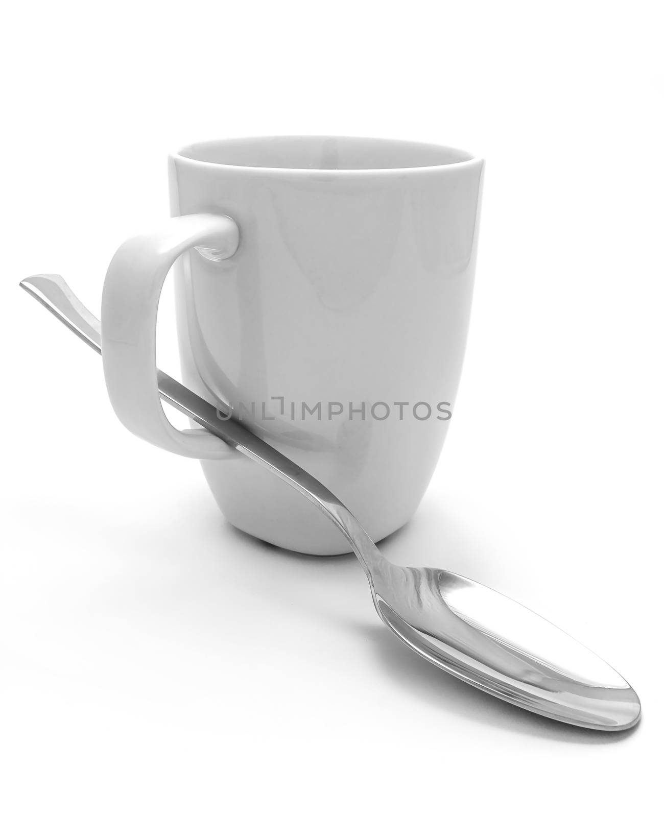 White mug and spoon on white background