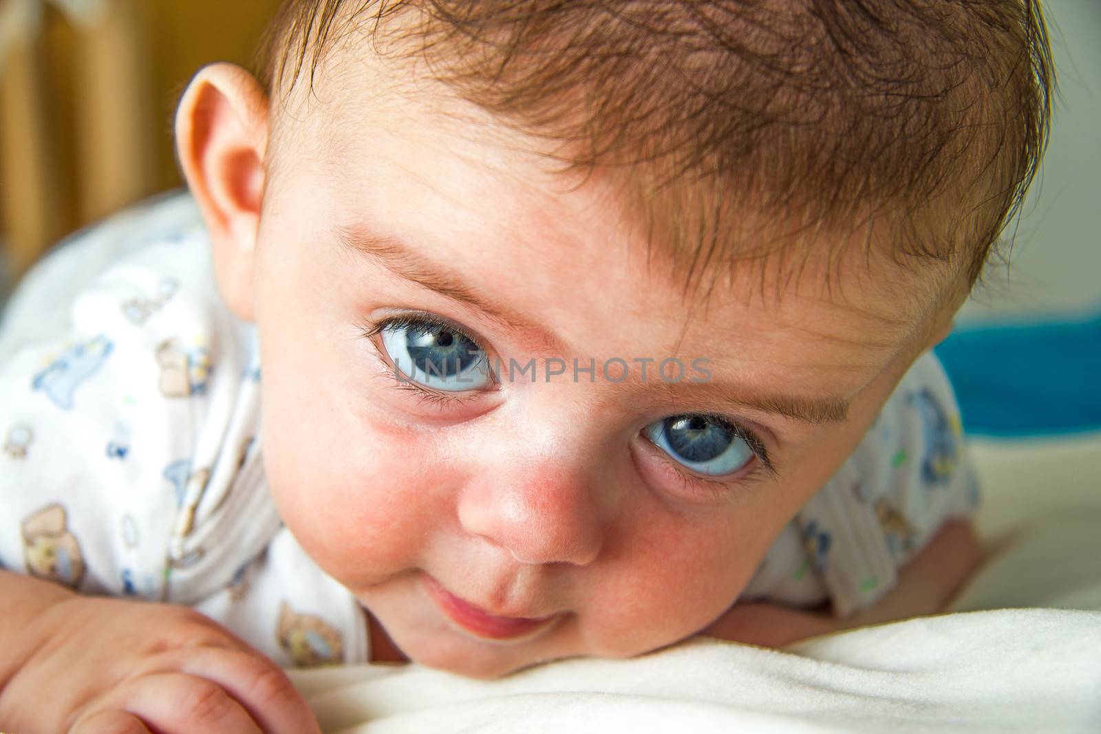 Cute blue eyed baby staring at the camera